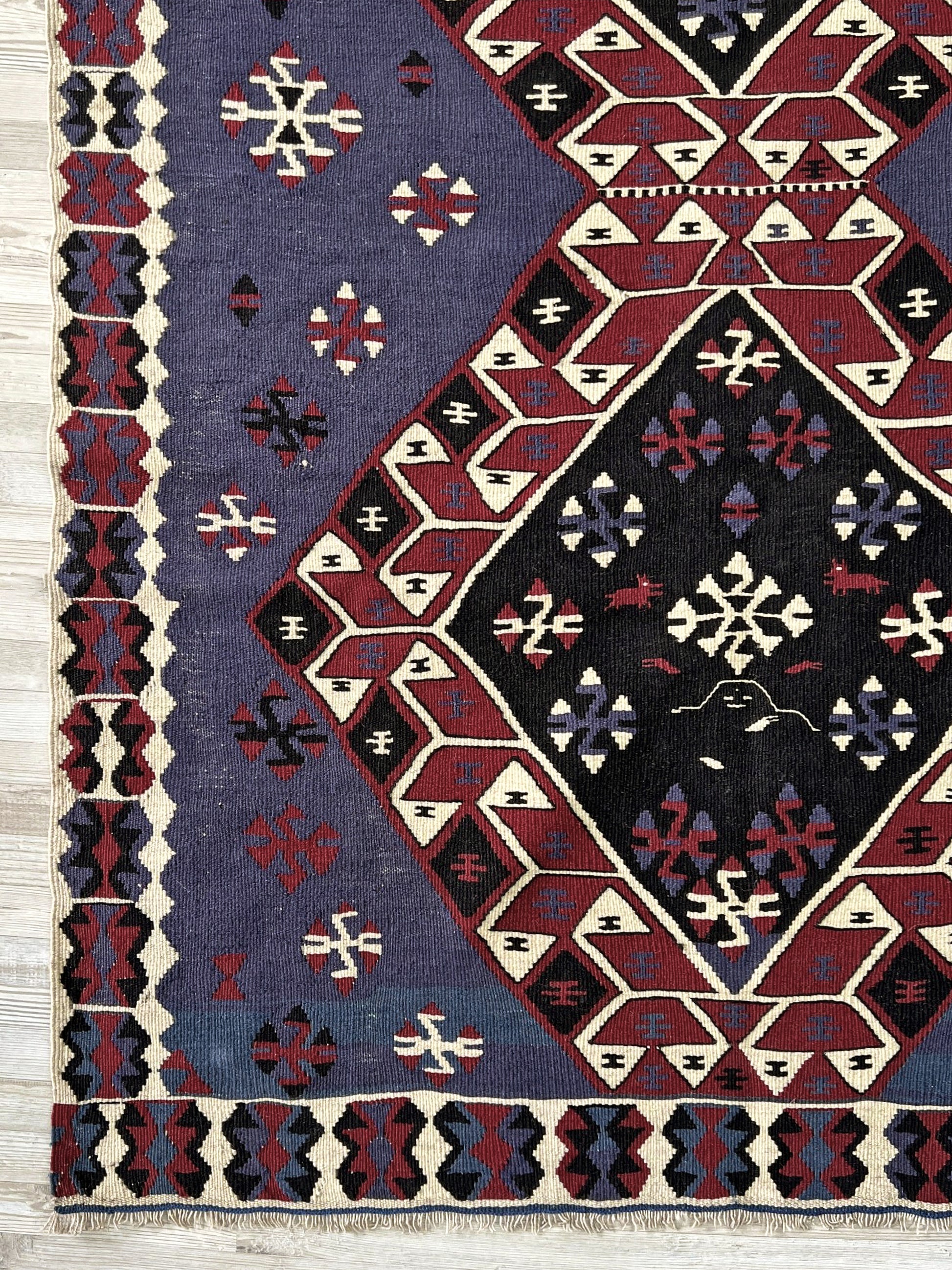 Violet blue Vintage Eastern Turkish kilim runner, 4x8, with bold geometric medallions in garnet red, ivory, navy, and black on a deep blue ground.
