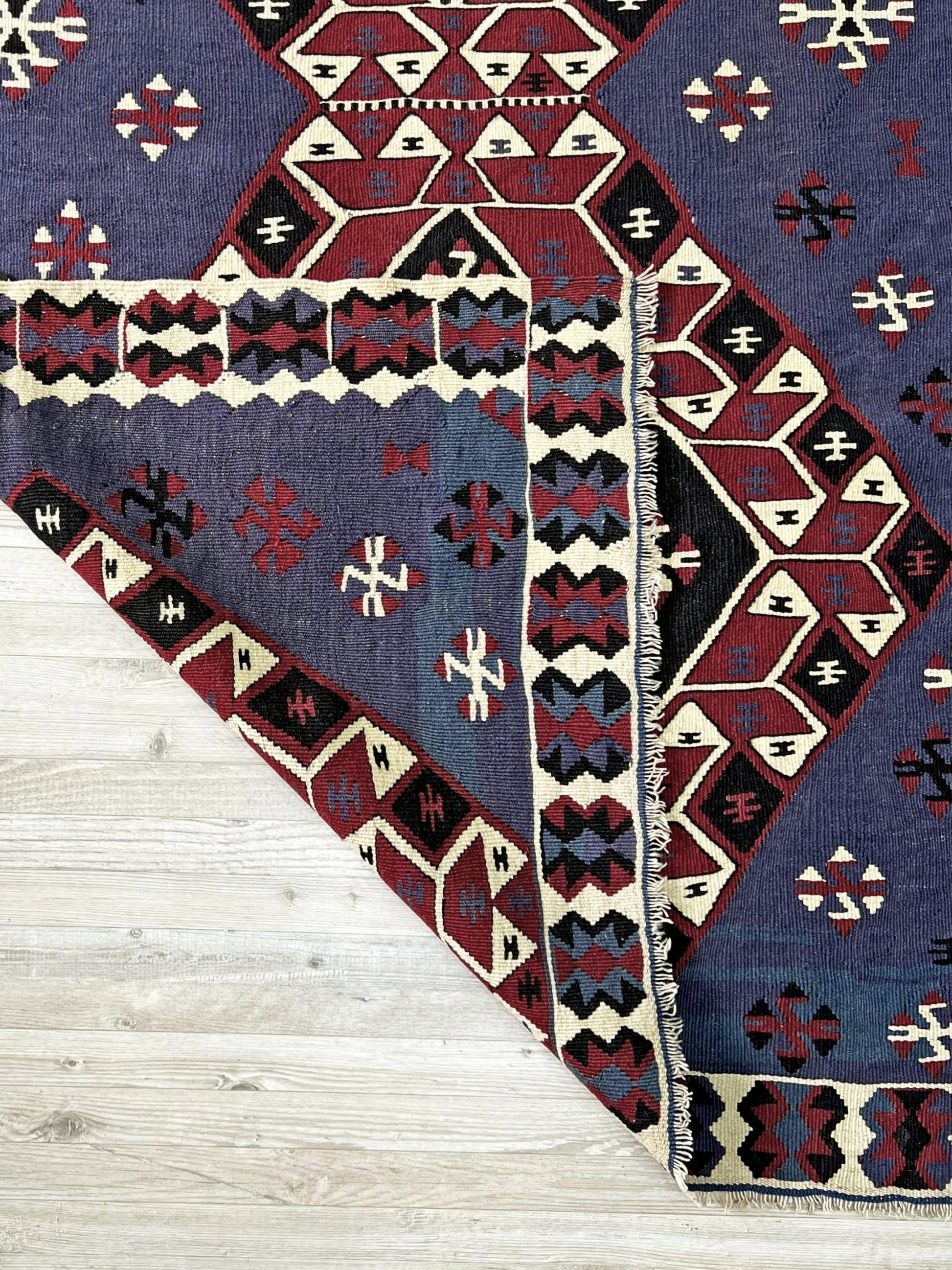 Violet blue Vintage Eastern Turkish kilim runner, 4x8, with bold geometric medallions in garnet red, ivory, navy, and black on a deep blue ground.