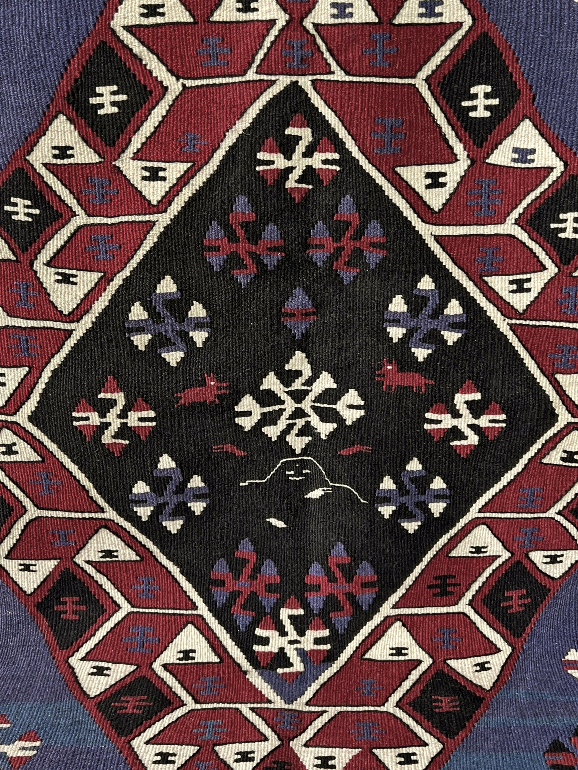 Violet blue Vintage Eastern Turkish kilim runner, 4x8, with bold geometric medallions in garnet red, ivory, navy, and black on a deep blue ground.