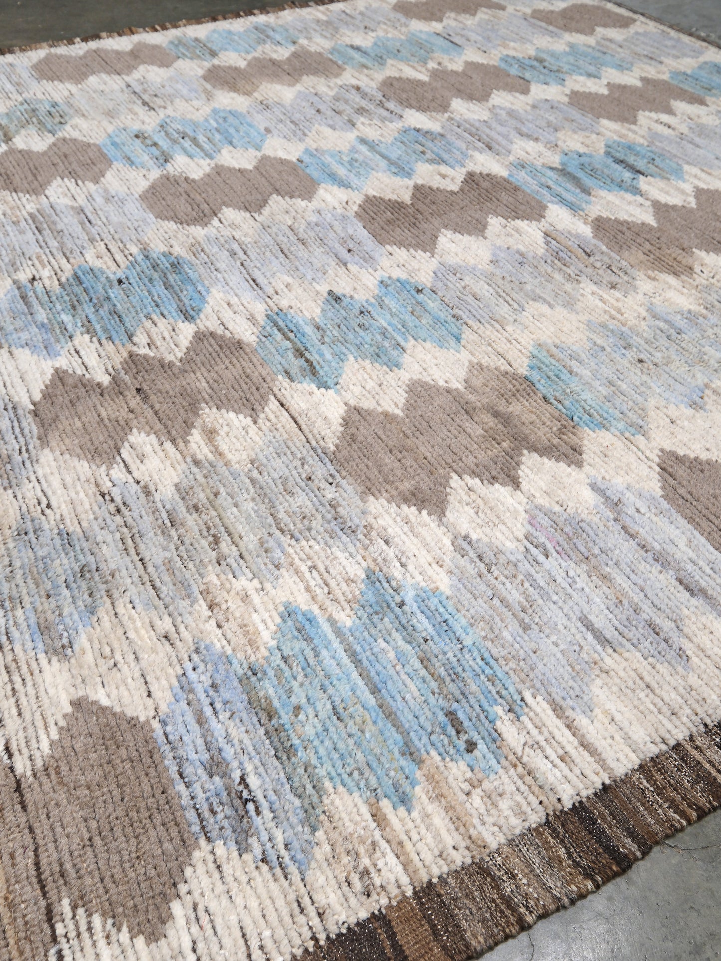 Soft blue Turkish Tulu rug with ivory, taupe and beige abstract geometric pattern, handmade textured Moroccan style wool area rug 8x10 from Indigo Rugs Burlingame Bay Area.