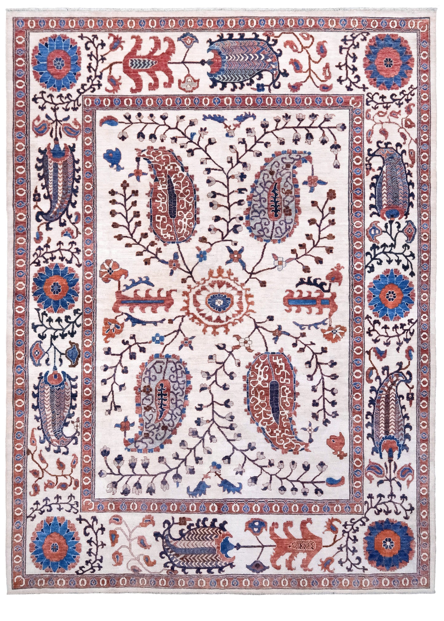 Ivory Suzani style handmade Turkish wool rug with paisley motifs, branching vines, flowers, indigo blue and rust accents, 9x12 from Indigo Rugs Burlingame Bay Area.