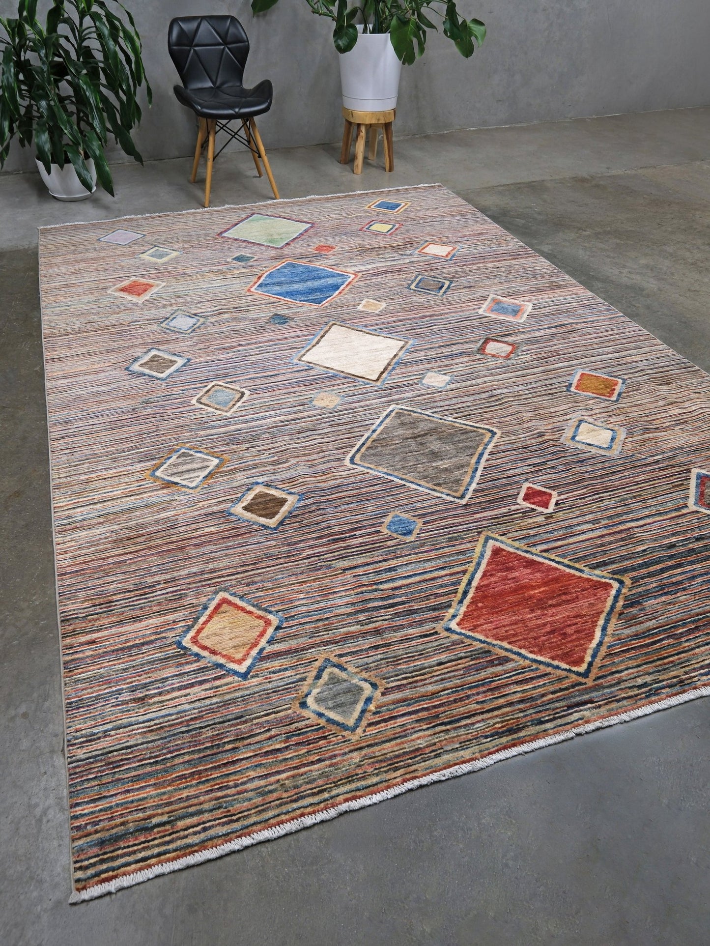 Modern Turkish Gabbeh style handmade wool rug with colorful diamond medallions on a striped field in blue, red, ivory, gray, green, camel and lavender, 7x10 from Indigo Rugs Burlingame Bay Area.