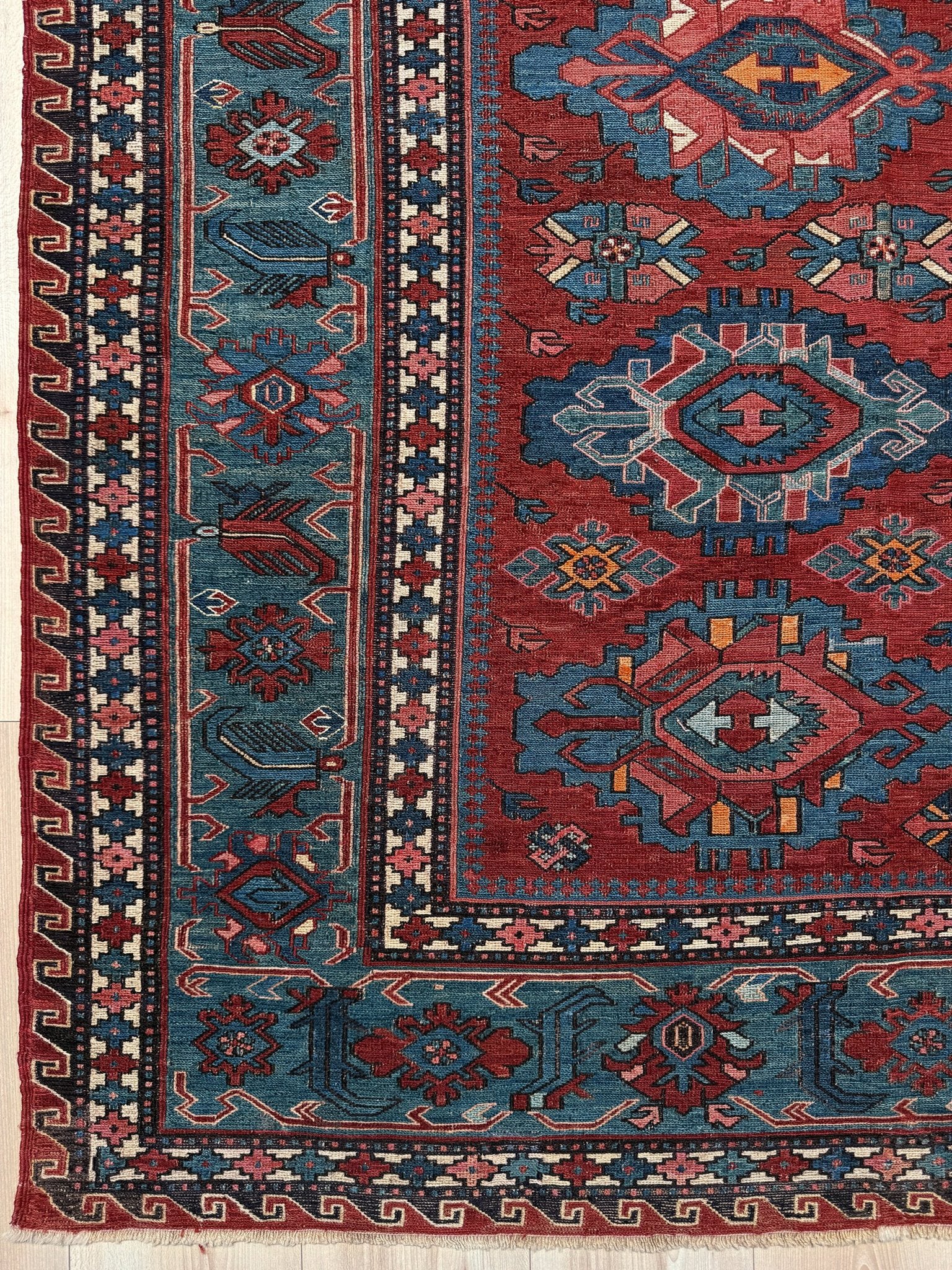 Antique Caucasian Soumak rug with madder red and indigo blue geometric medallions, woven in the South Caucasus circa 1925, available at top-rated rug shop in San Mateo, SF Bay Area with free shipping.