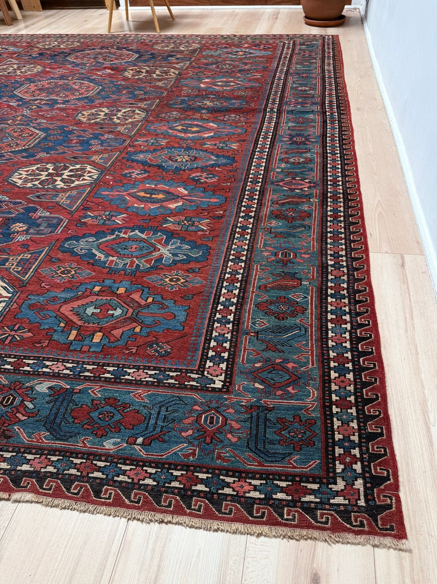 Antique Caucasian Soumak rug with madder red and indigo blue geometric medallions, woven in the South Caucasus circa 1925, available at top-rated rug shop in San Mateo, SF Bay Area with free shipping.