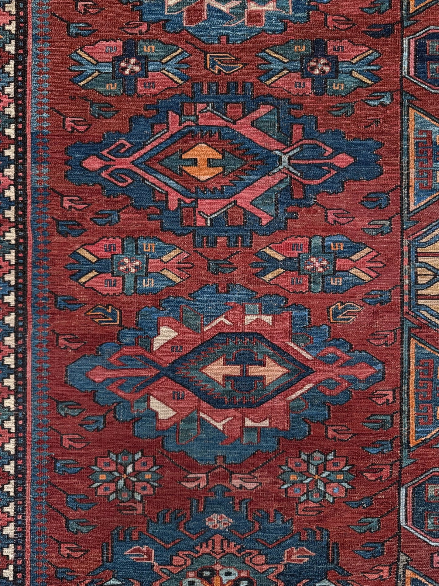 Antique Caucasian Soumak rug with madder red and indigo blue geometric medallions, woven in the South Caucasus circa 1925, available at top-rated rug shop in San Mateo, SF Bay Area with free shipping.