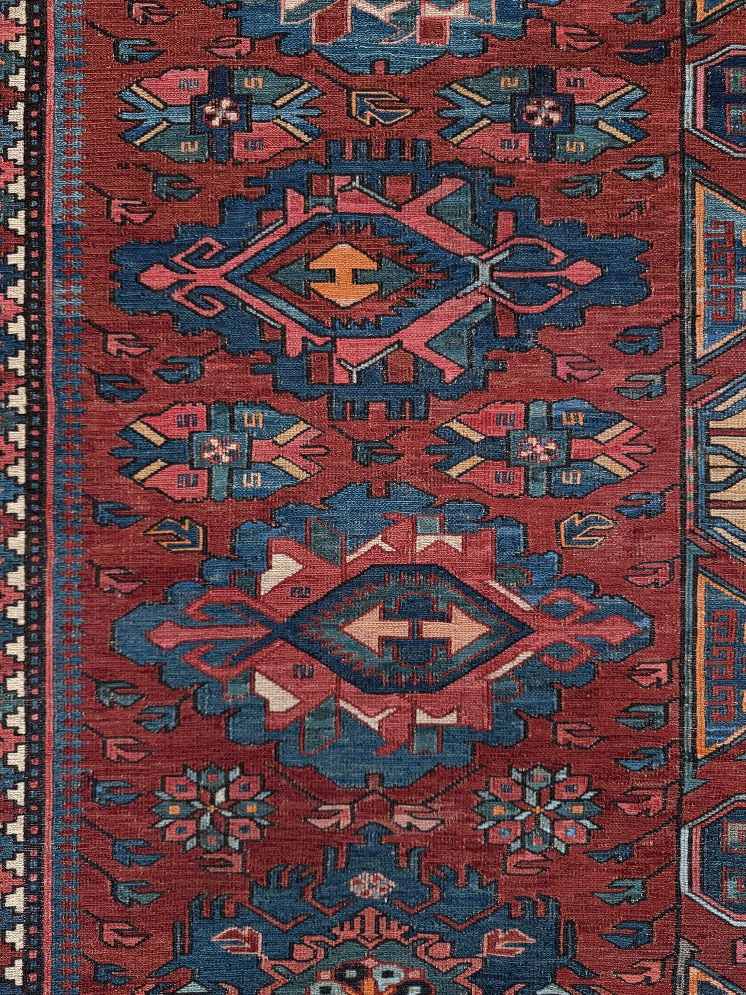 Antique Caucasian Soumak rug with madder red and indigo blue geometric medallions, woven in the South Caucasus circa 1925, available at top-rated rug shop in San Mateo, SF Bay Area with free shipping.