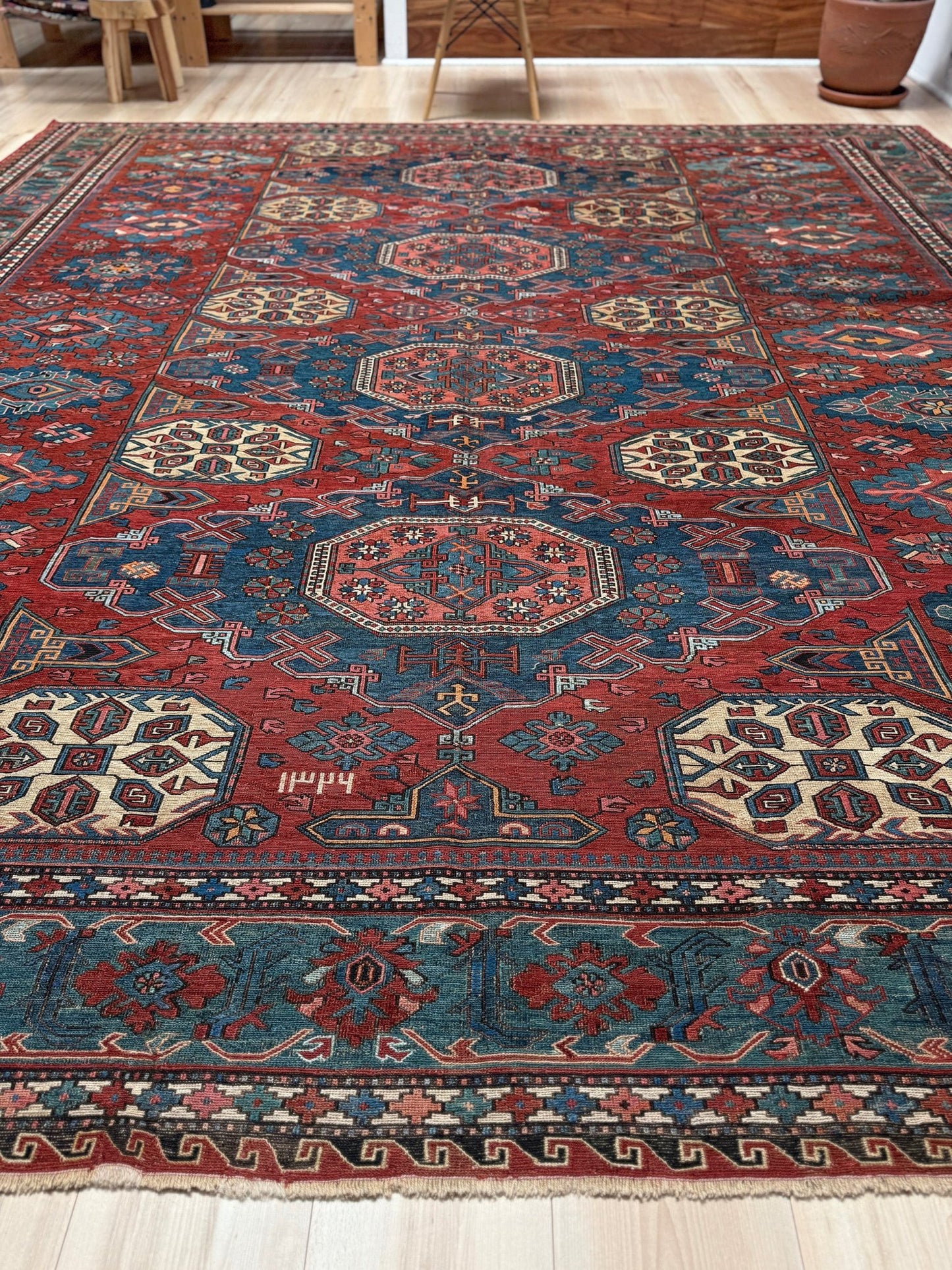 Antique Caucasian Soumak rug with madder red and indigo blue geometric medallions, woven in the South Caucasus circa 1925, available at top-rated rug shop in San Mateo, SF Bay Area with free shipping.