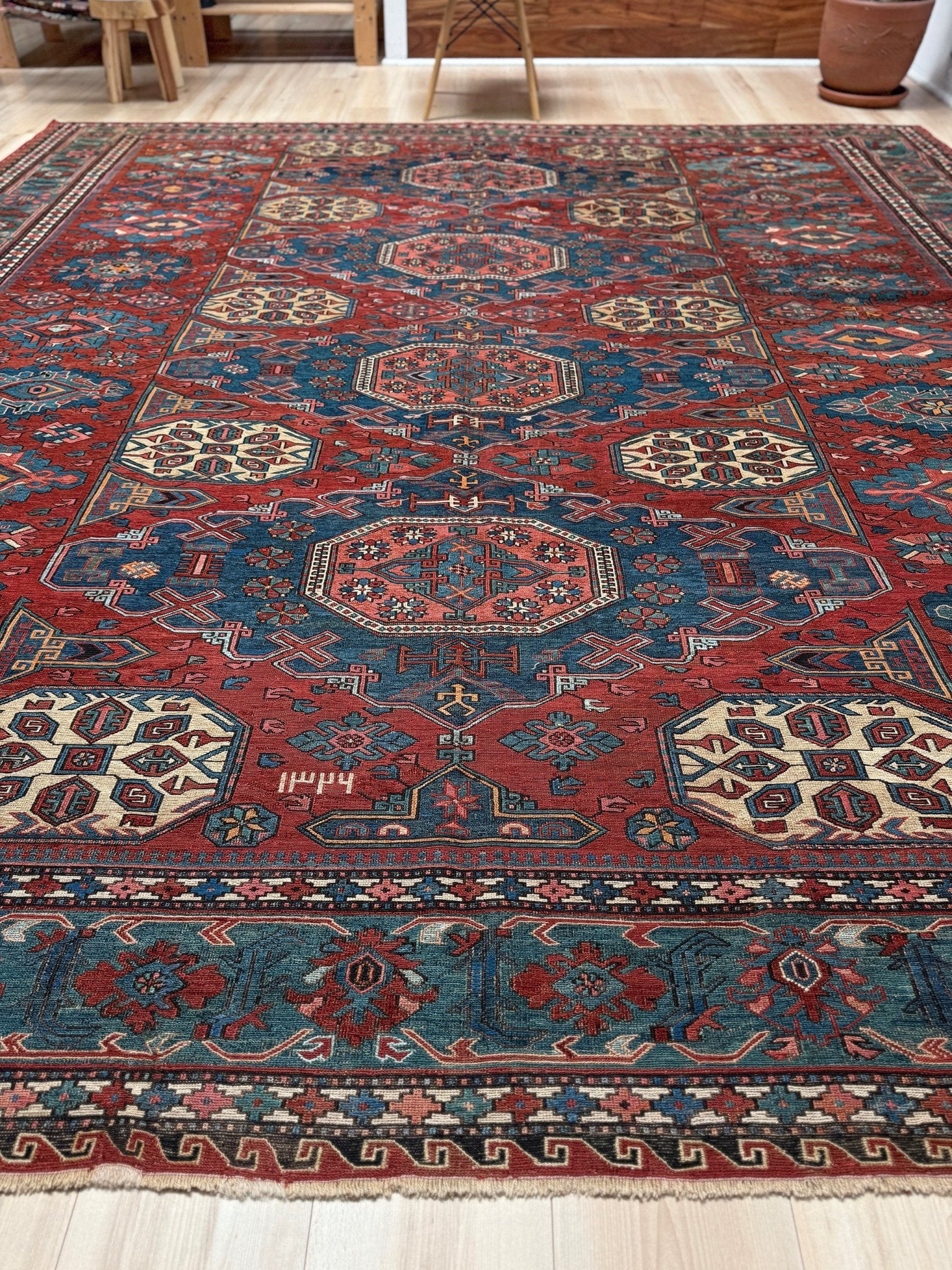 Antique Caucasian Soumak rug with madder red and indigo blue geometric medallions, woven in the South Caucasus circa 1925, available at top-rated rug shop in San Mateo, SF Bay Area with free shipping.