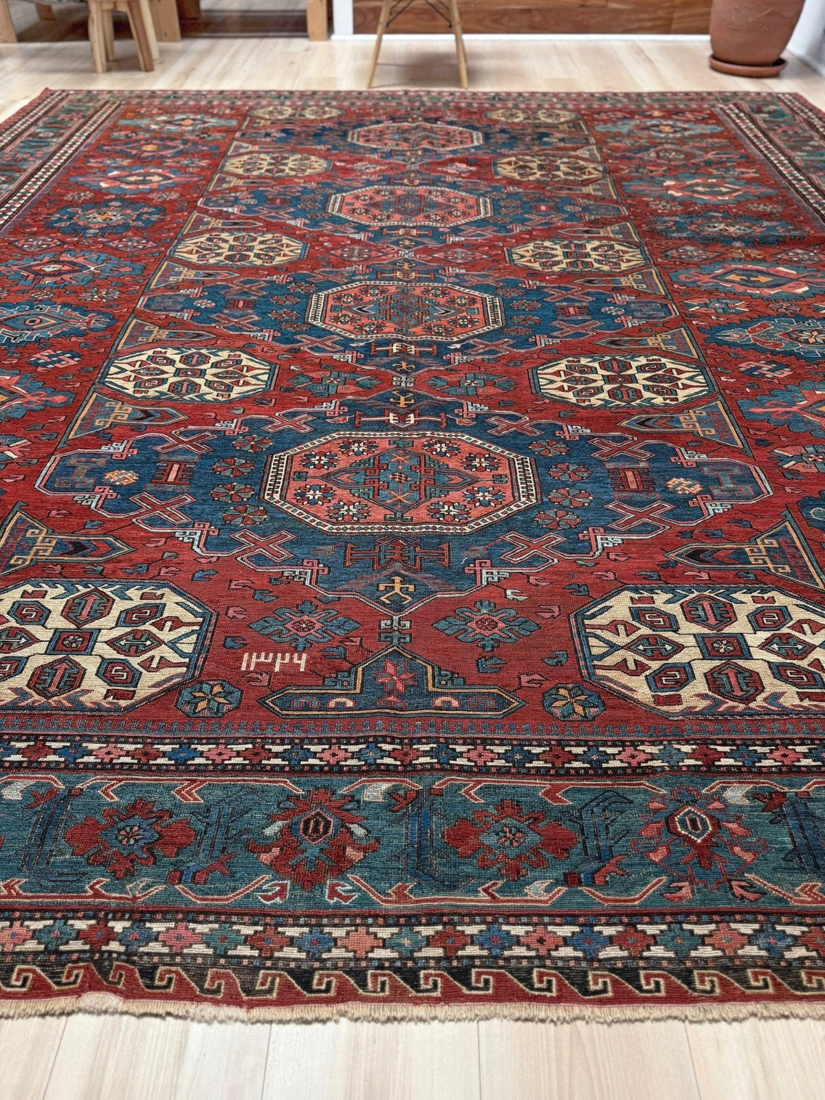 Antique Konagkend Kuba Caucasian Soumak rug, 10x10 square, with madder red and deep indigo field, large octagonal medallions, blue geometric borders, handwoven wool 