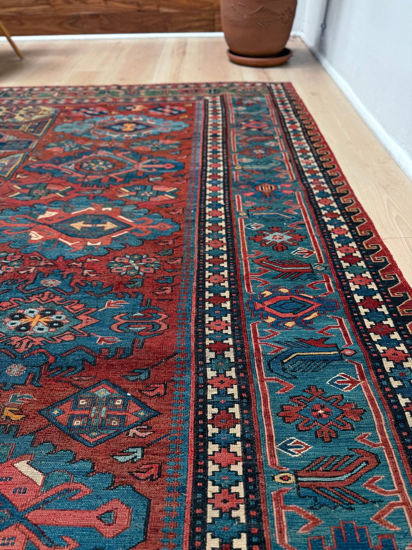 Antique Caucasian Soumak rug with madder red and indigo blue geometric medallions, woven in the South Caucasus circa 1925, available at top-rated rug shop in San Mateo, SF Bay Area with free shipping.