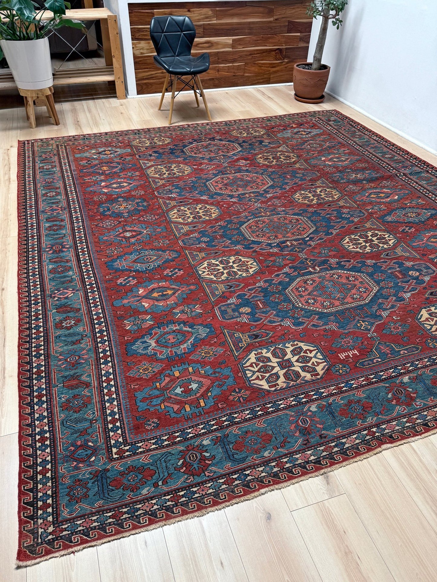 Antique Caucasian Soumak rug with madder red and indigo blue geometric medallions, woven in the South Caucasus circa 1925, available at top-rated rug shop in San Mateo, SF Bay Area with free shipping.