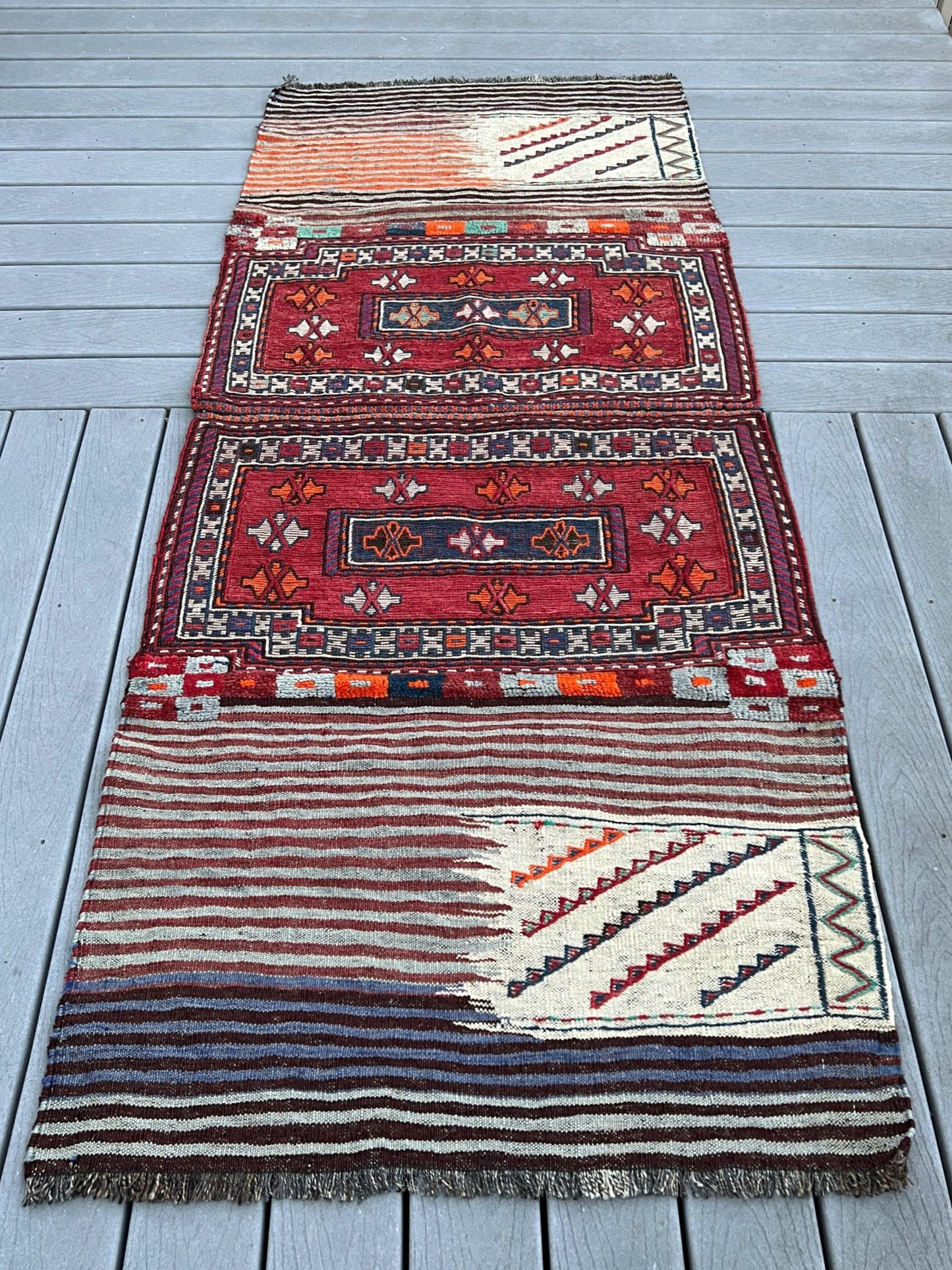 Vintage Bakhtiari Khorjin saddle bag rug 3x8 — 1940s Persian tribal runner handwoven with flatweave, pile, and soumak techniques in crimson red, indigo blue, and ivory — antique wool rug from Northwest Persia, Indigo Rugs Burlingame CA