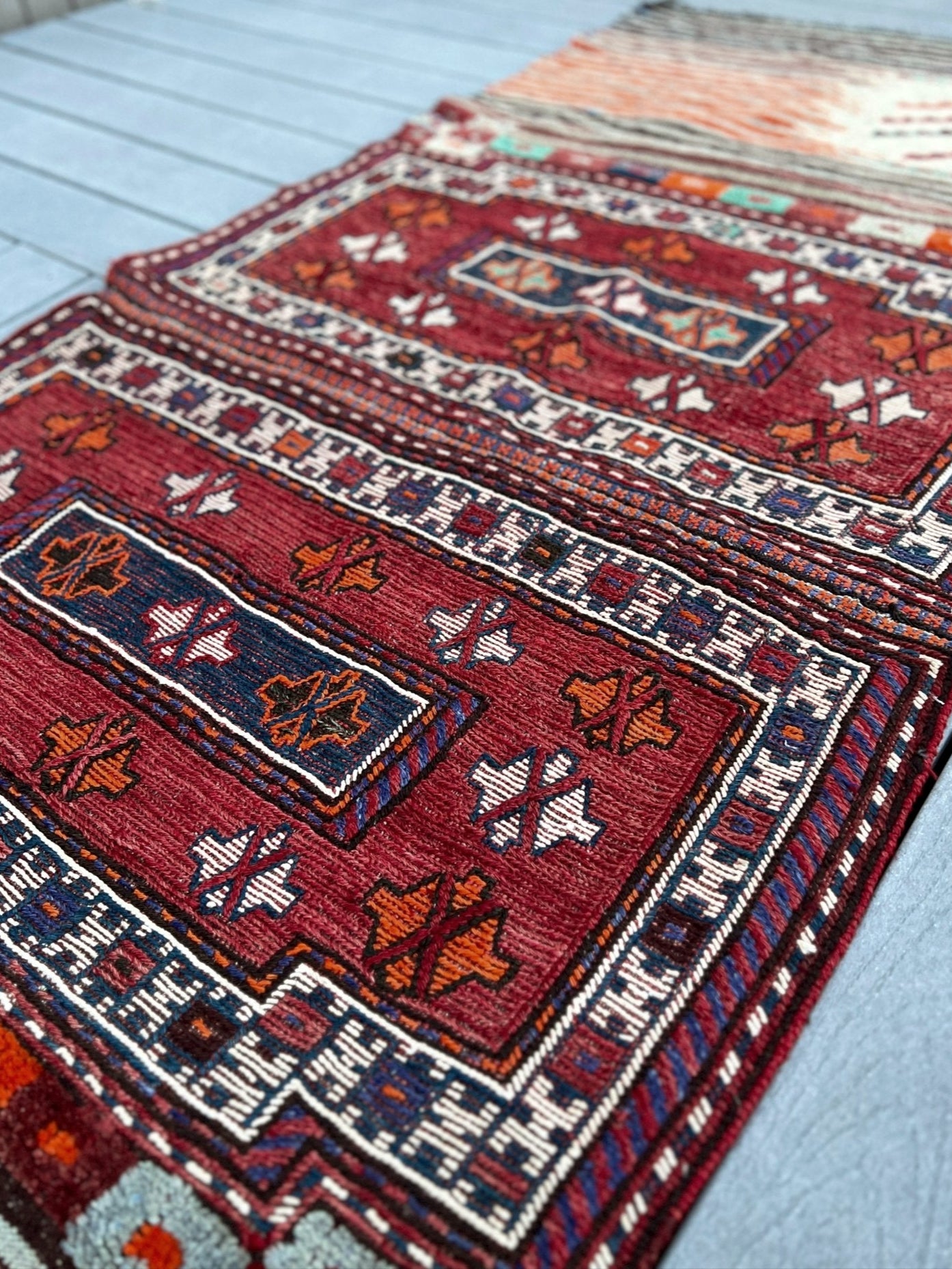 Vintage Bakhtiari Khorjin saddle bag rug 3x8 — 1940s Persian tribal runner handwoven with flatweave, pile, and soumak techniques in crimson red, indigo blue, and ivory — antique wool rug from Northwest Persia, Indigo Rugs Burlingame CA