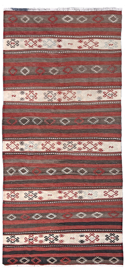 3x6 vintage turkish striped kilim rug with red, white, and black geometric pattern