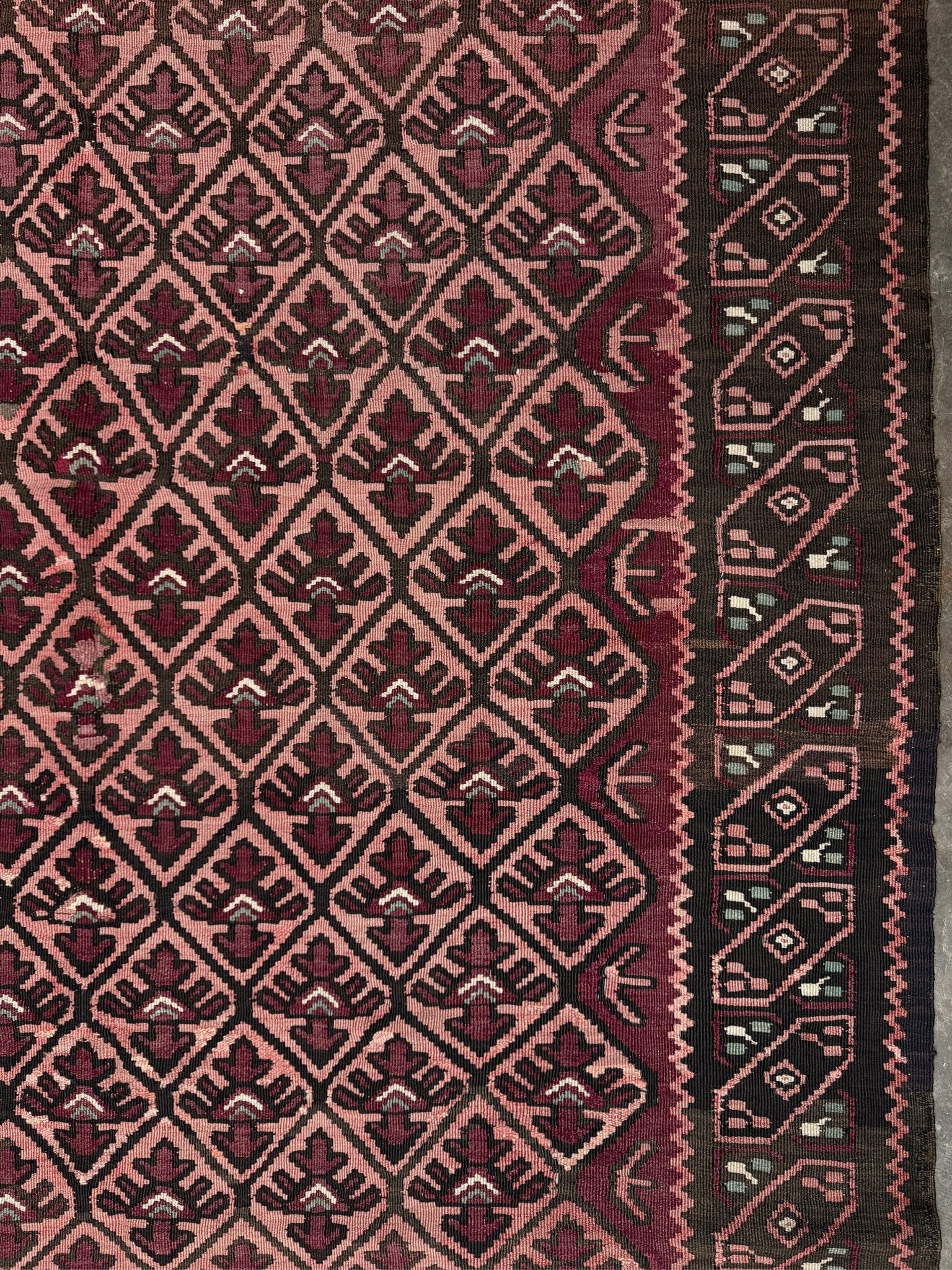 Vintage Caucasian kilim rug with wine red and dusty rose lattice field and tribal animal motifs, handwoven wool flatweave 5x10 runner size from Indigo Rugs Burlingame California