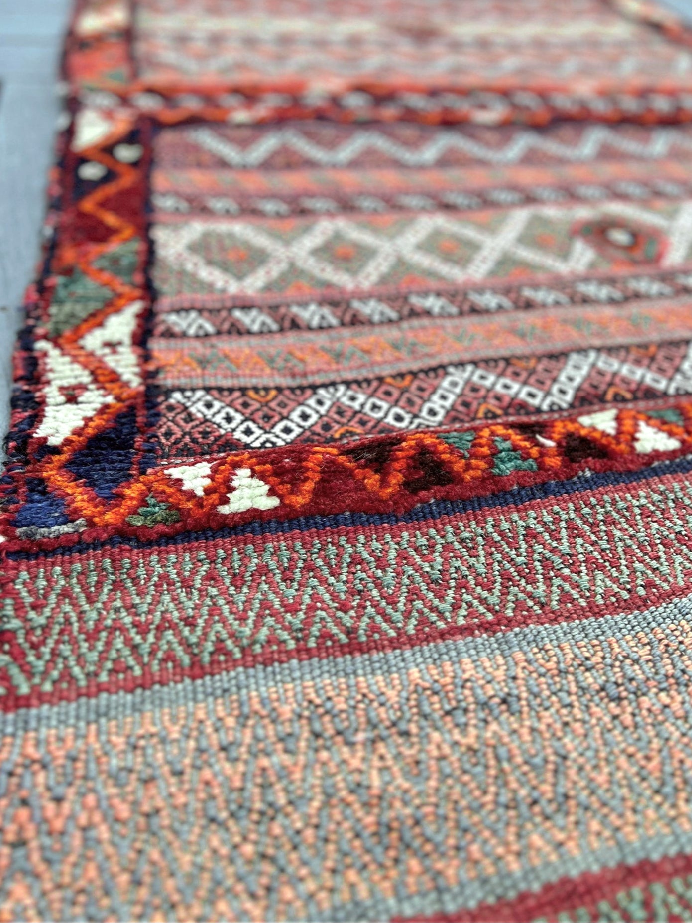 Vintage Bakhtiari khorjin saddle bag wall art rug (3'x6'7") featuring terracotta and ivory diamond motifs, olive and charcoal tribal patterns, and rare triple-weave structure — handmade in NW Persia, circa 1940s