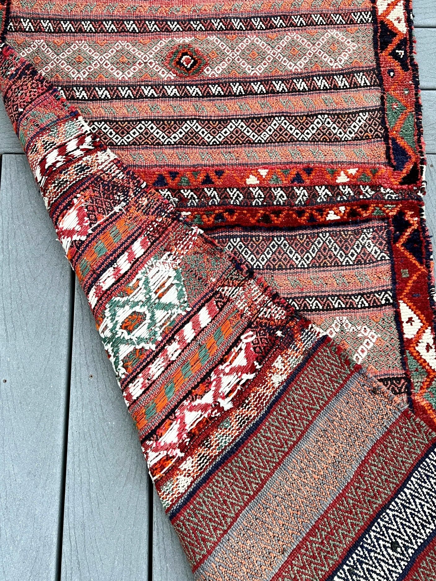 Vintage Bakhtiari khorjin saddle bag wall art rug (3'x6'7") featuring terracotta and ivory diamond motifs, olive and charcoal tribal patterns, and rare triple-weave structure — handmade in NW Persia, circa 1940s