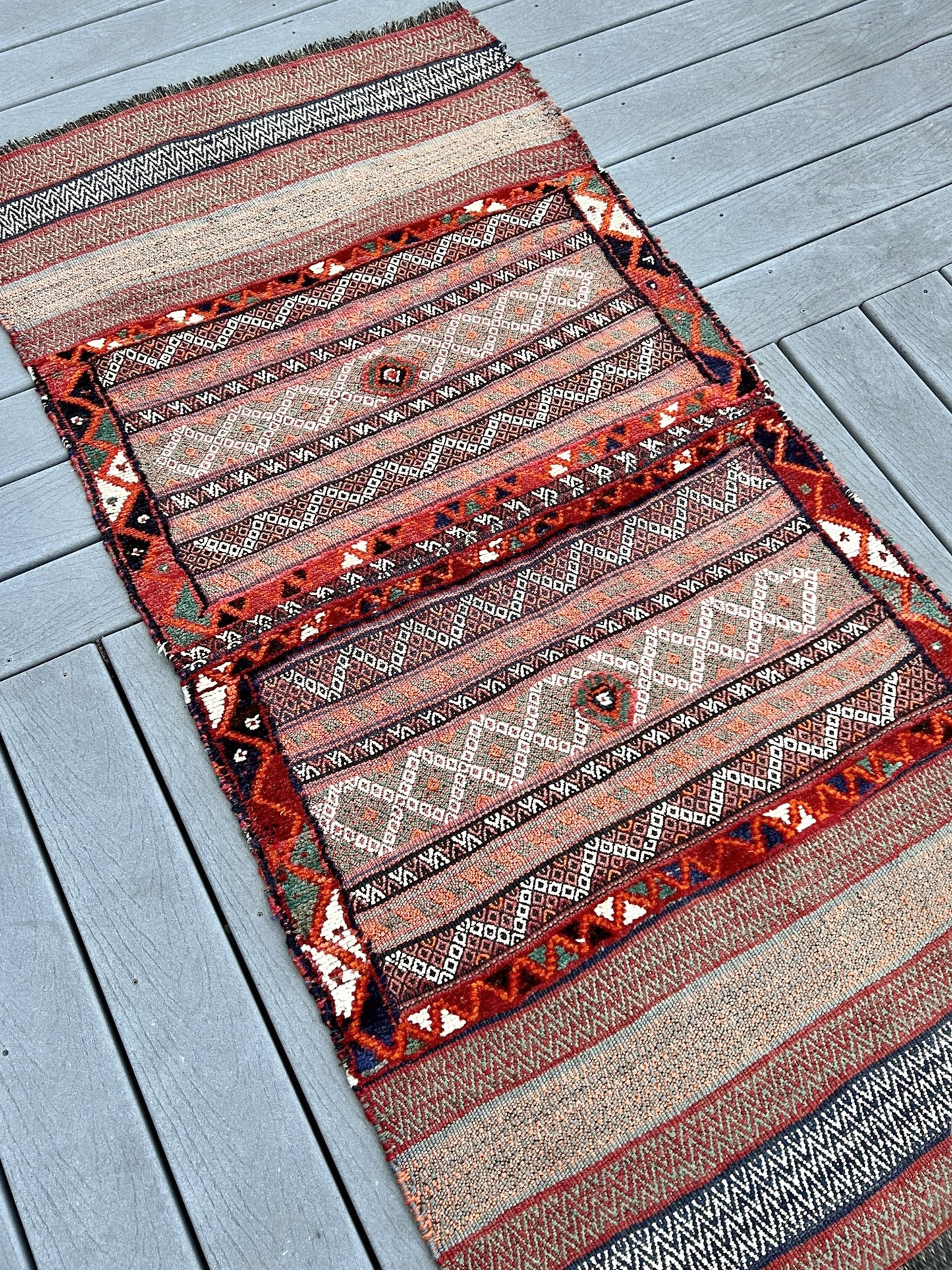 Vintage Bakhtiari khorjin saddle bag wall art rug (3'x6'7") featuring terracotta and ivory diamond motifs, olive and charcoal tribal patterns, and rare triple-weave structure — handmade in NW Persia, circa 1940s