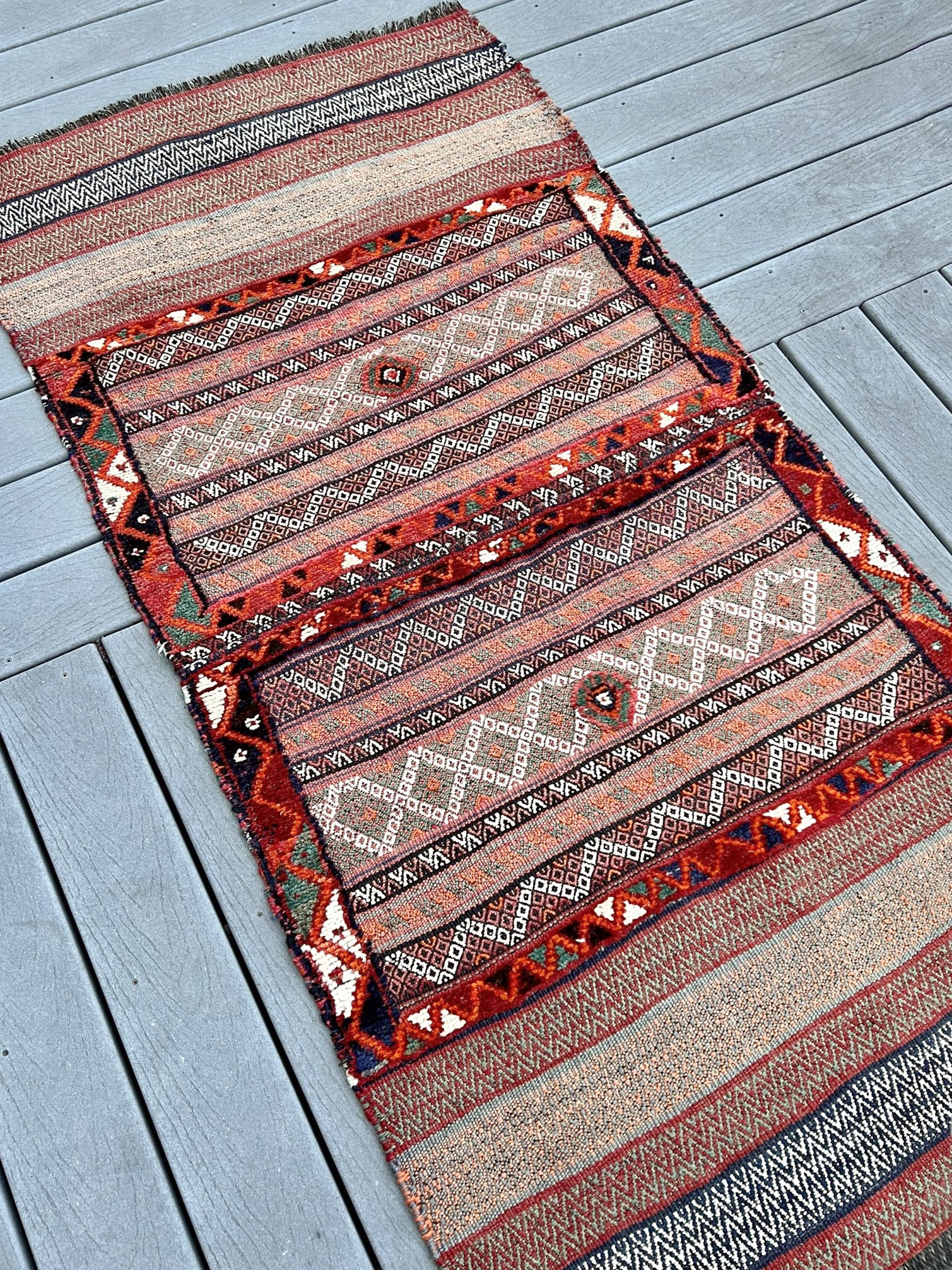 Vintage Bakhtiari khorjin saddle bag wall art rug (3'x6'7") featuring terracotta and ivory diamond motifs, olive and charcoal tribal patterns, and rare triple-weave structure — handmade in NW Persia, circa 1940s