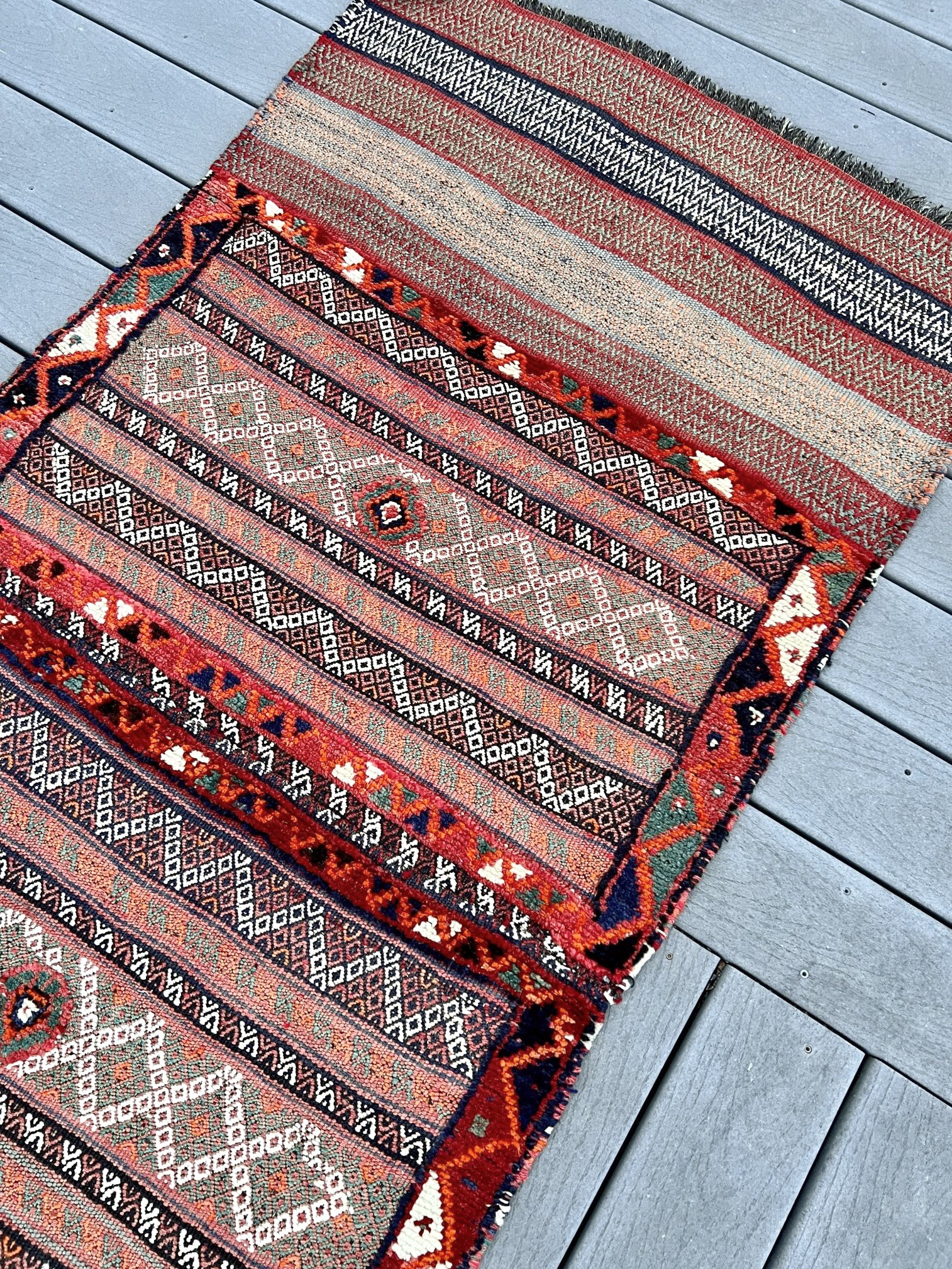 Vintage Bakhtiari khorjin saddle bag wall art rug (3'x6'7") featuring terracotta and ivory diamond motifs, olive and charcoal tribal patterns, and rare triple-weave structure — handmade in NW Persia, circa 1940s