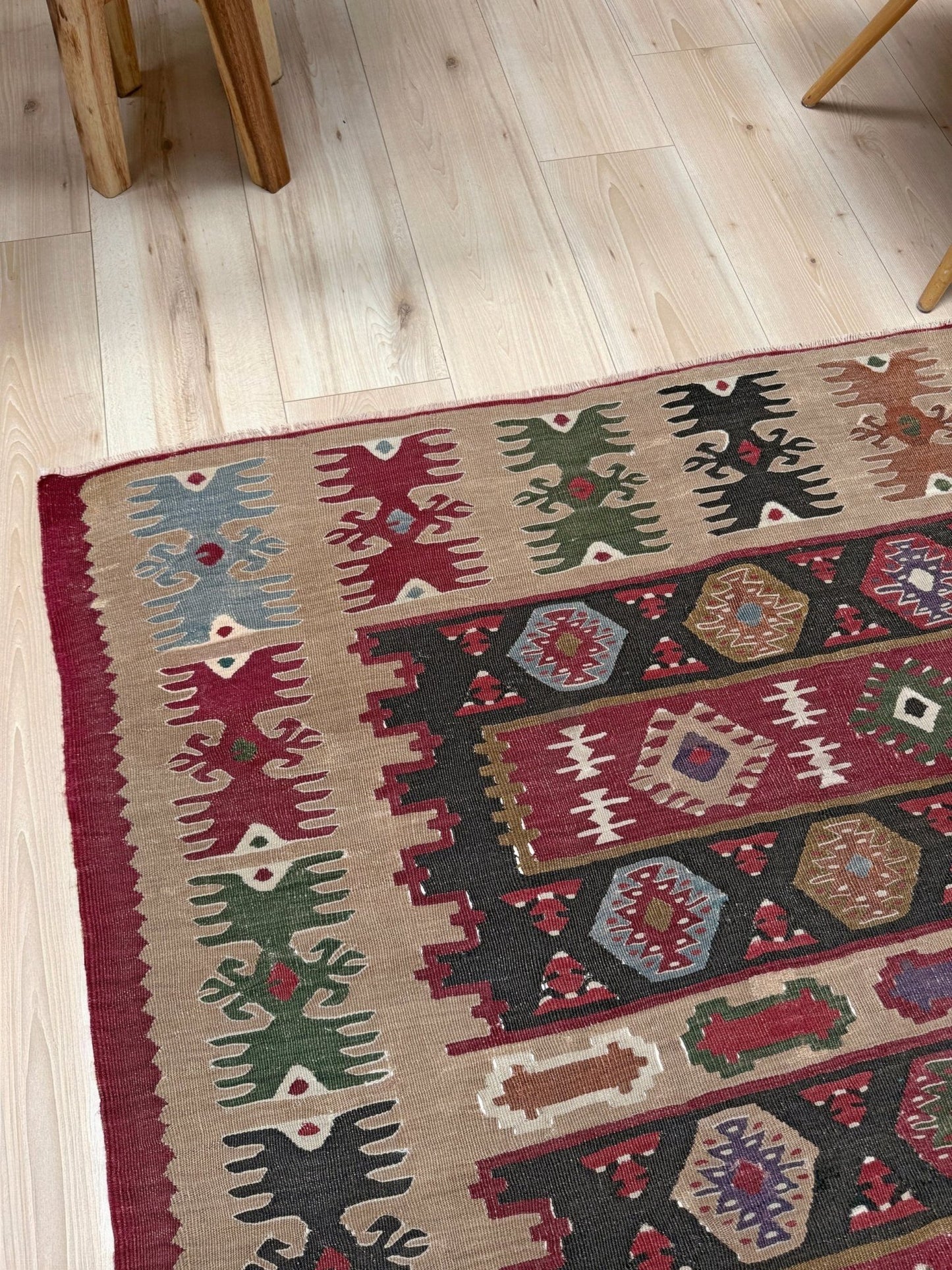 Handmade vintage Pirot Sharkoy kilim rug from the Balkans, approx. 8x10, with garnet red geometric bands, ivory tribal border, and charcoal, sage, and dusty blue motifs.