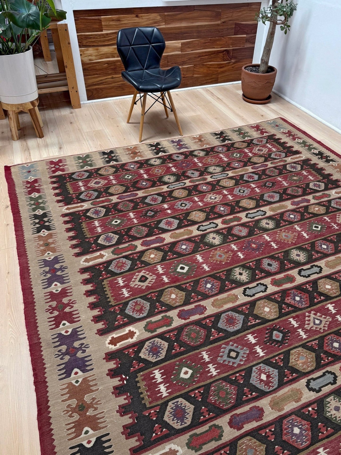 Handmade vintage Pirot Sharkoy kilim rug from the Balkans, approx. 8x10, with garnet red geometric bands, ivory tribal border, and charcoal, sage, and dusty blue motifs.