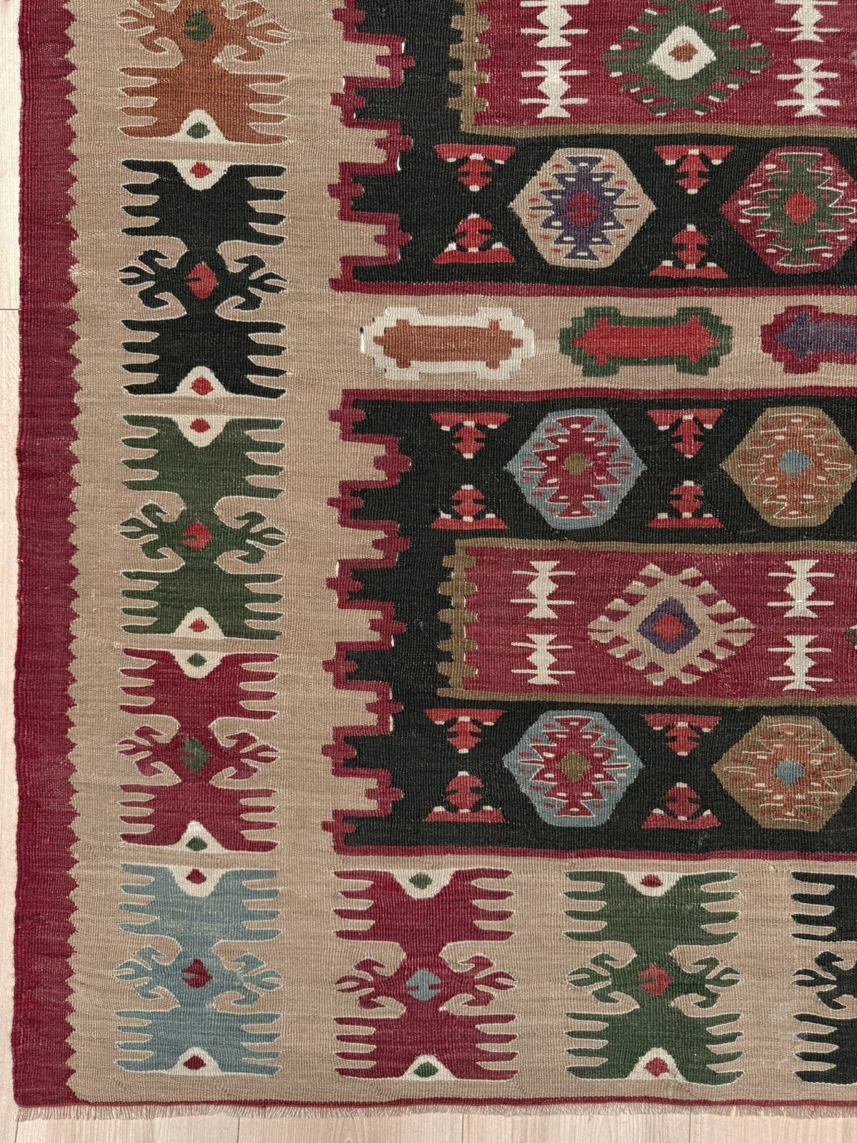 Handmade vintage Pirot Sharkoy kilim rug from the Balkans, square approx. 8x10, with garnet red geometric bands, ivory tribal border, and charcoal, sage, and dusty blue motifs.