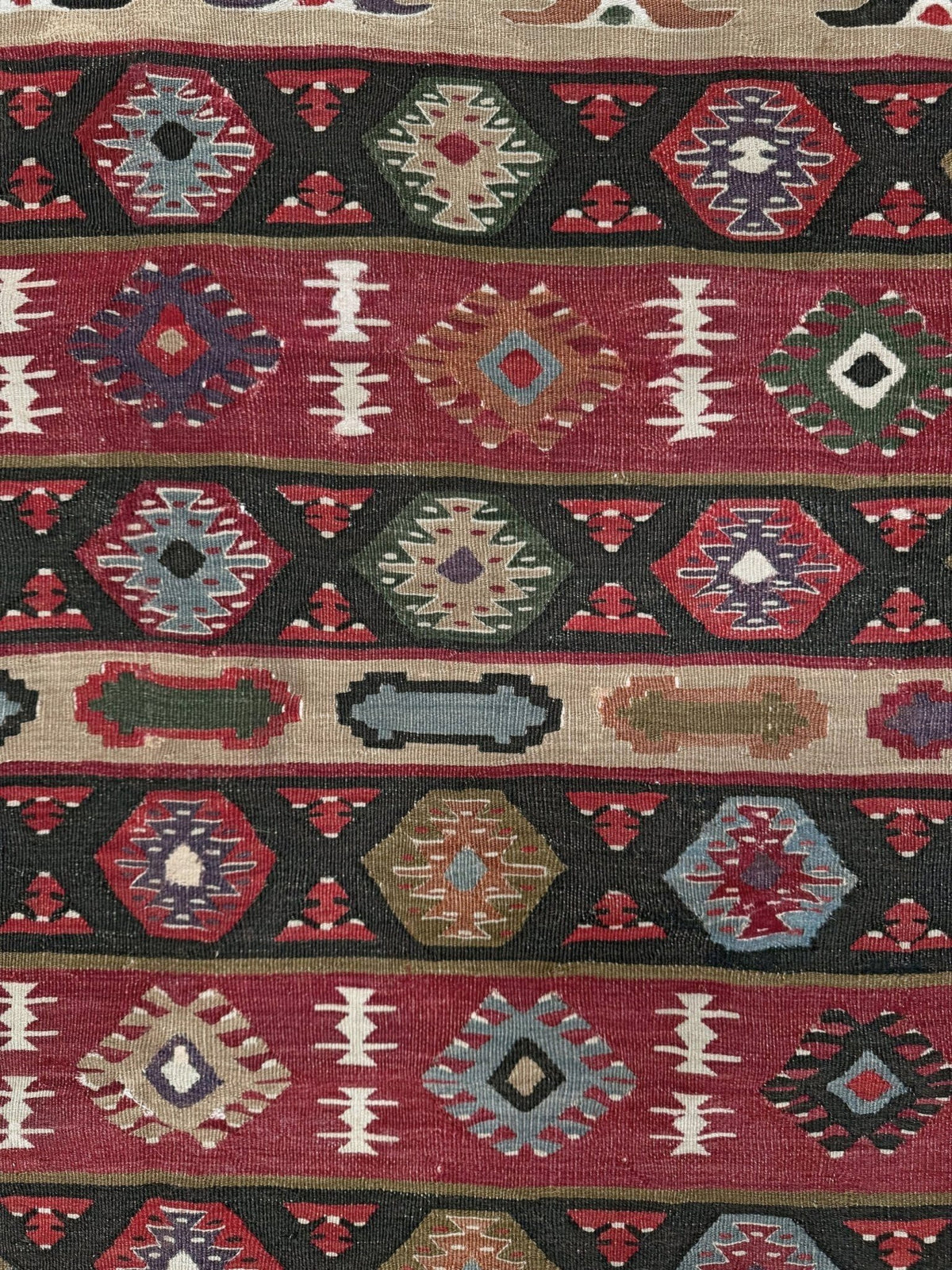 Handmade vintage Pirot Sharkoy kilim rug from the Balkans, square approx. 8x10, with garnet red geometric bands, ivory tribal border, and charcoal, sage, and dusty blue motifs.