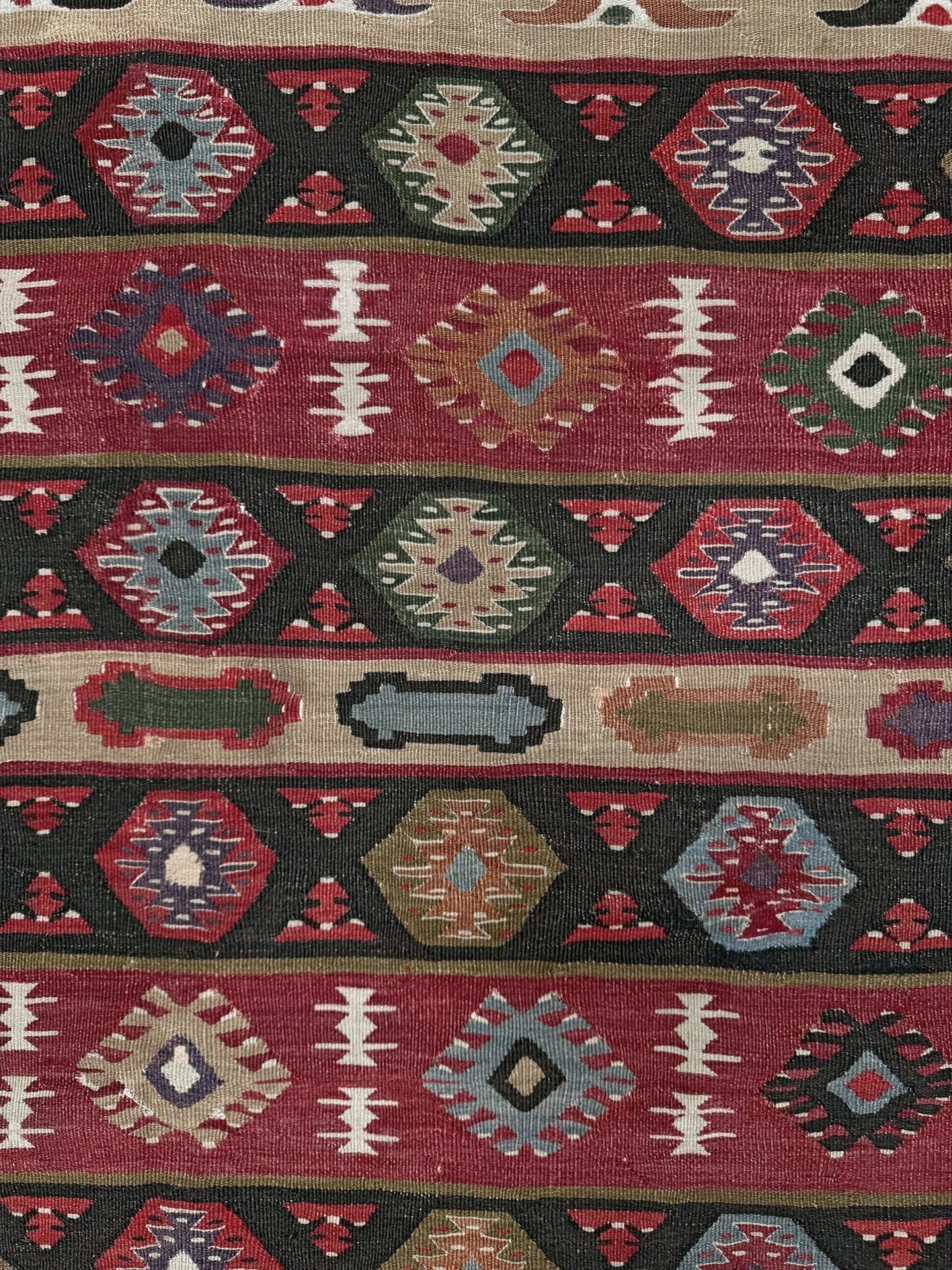 Handmade vintage Pirot Sharkoy kilim rug from the Balkans, approx. 8x10, with garnet red geometric bands, ivory tribal border, and charcoal, sage, and dusty blue motifs.