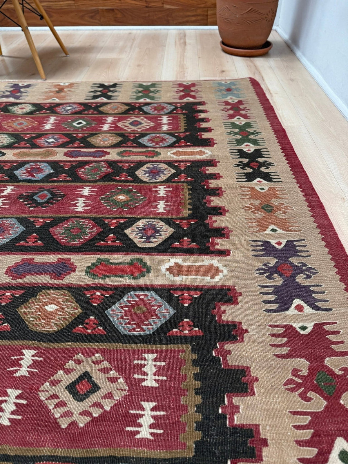 Handmade vintage Pirot Sharkoy kilim rug from the Balkans, square approx. 8x10, with garnet red geometric bands, ivory tribal border, and charcoal, sage, and dusty blue motifs.