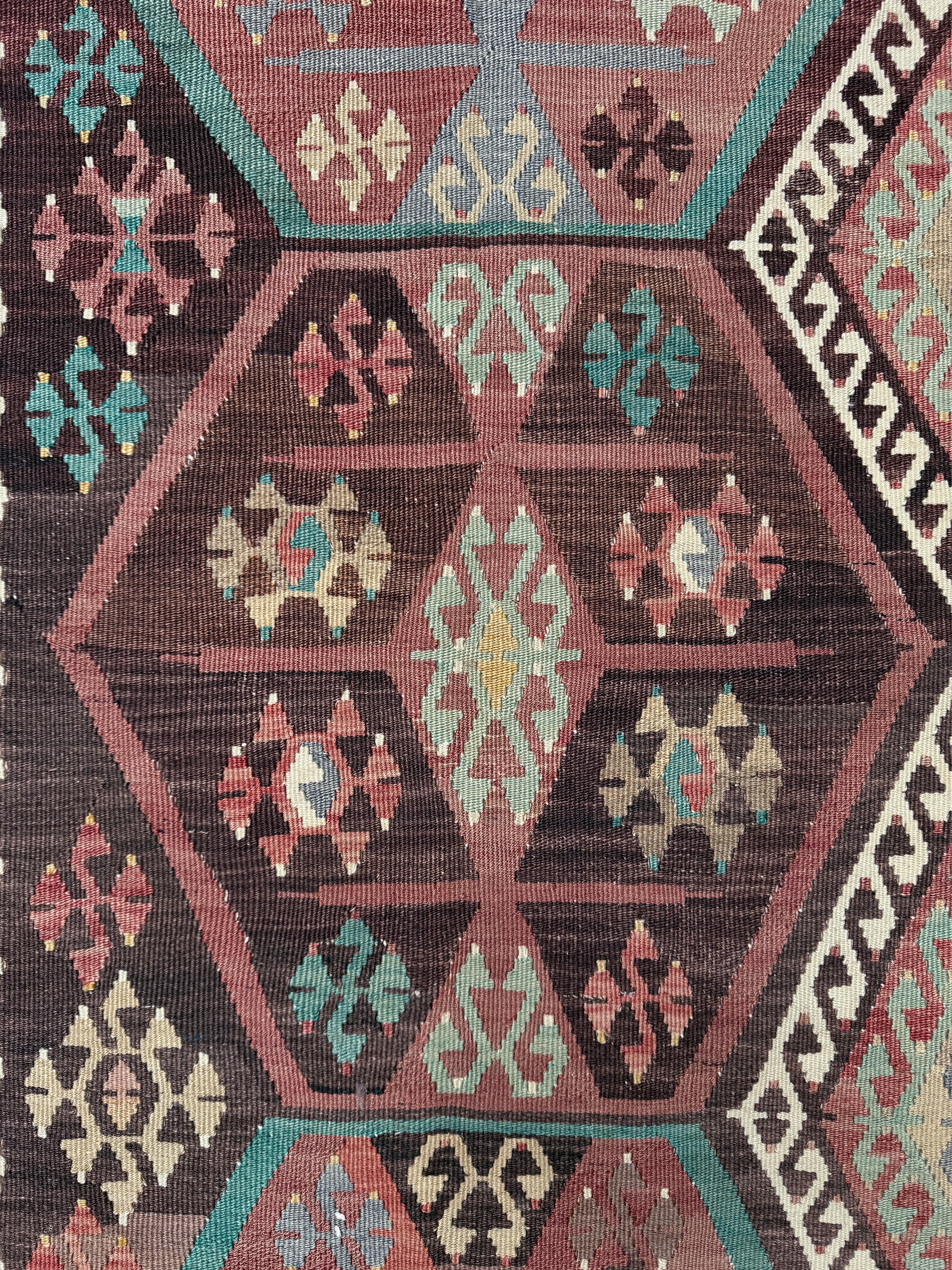 Vintage Kayseri Turkish kilim rug with earthy colors and geometric design, handmade wool flatweave 5x11 from Indigo Rugs Burlingame Bay Area.