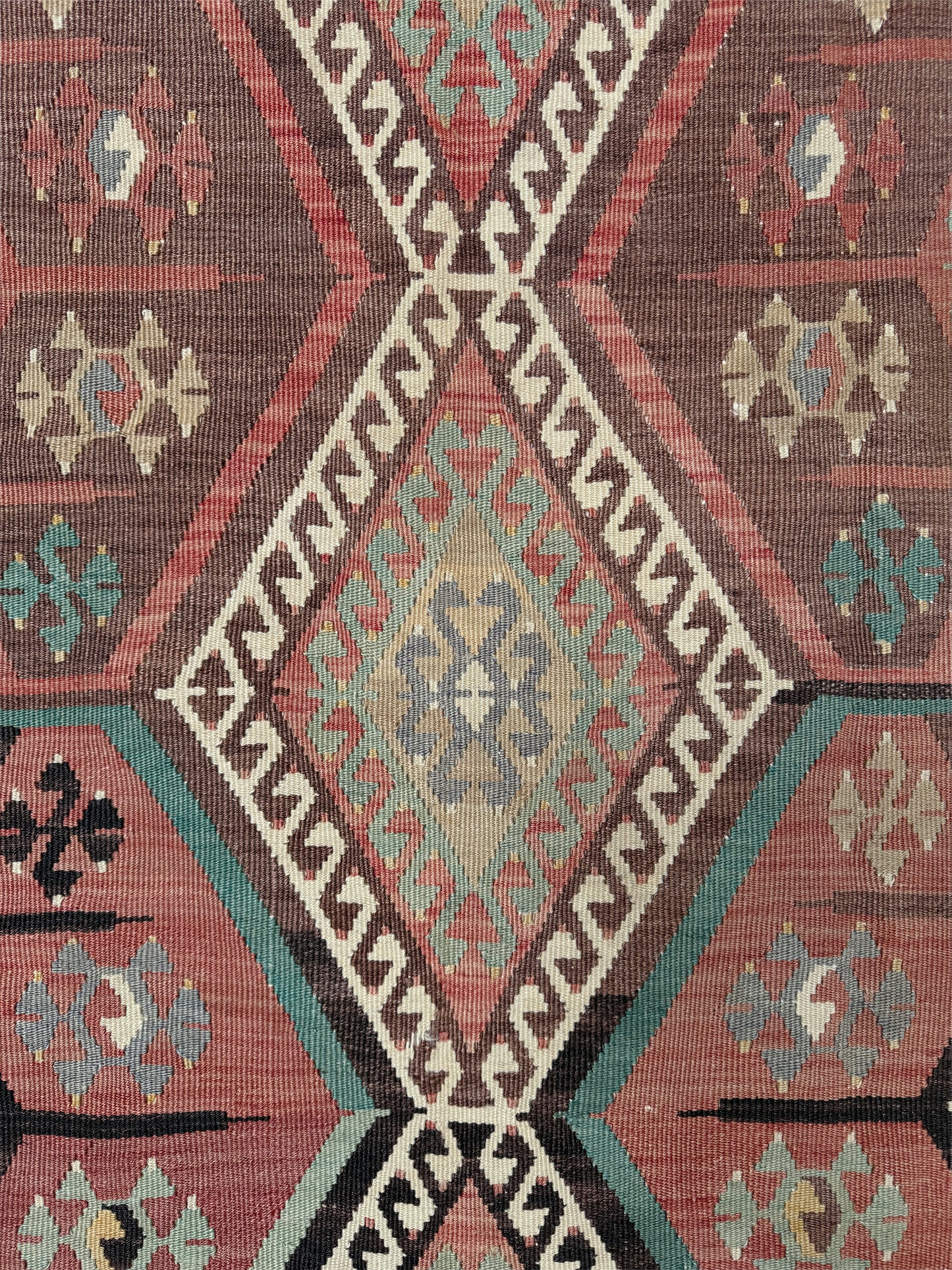 Vintage Kayseri Turkish kilim rug with earthy colors and geometric design, handmade wool flatweave 5x11 from Indigo Rugs Burlingame Bay Area.