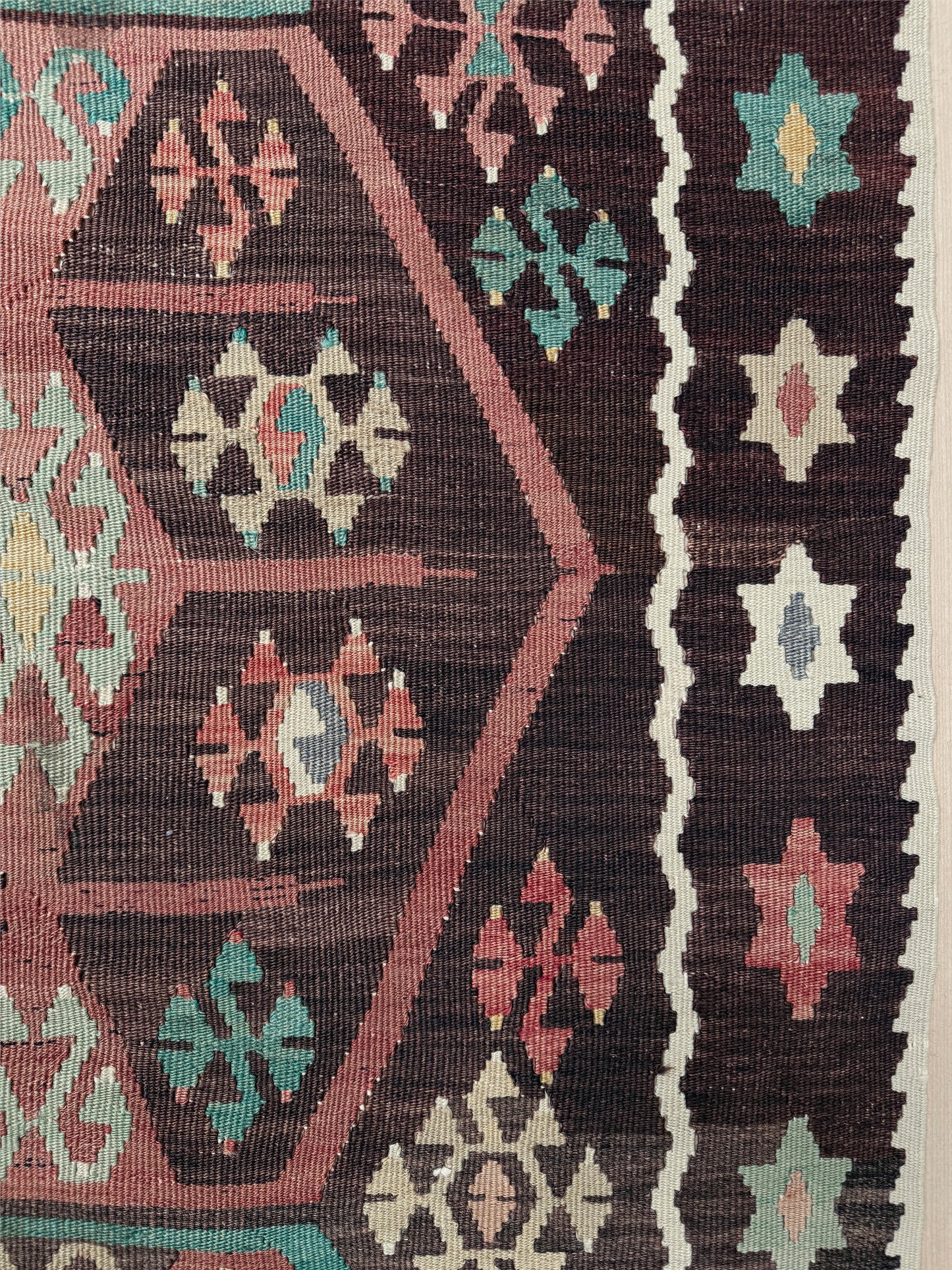 Vintage Kayseri Turkish kilim rug with earthy colors and geometric design, handmade wool flatweave 5x11 from Indigo Rugs Burlingame Bay Area.