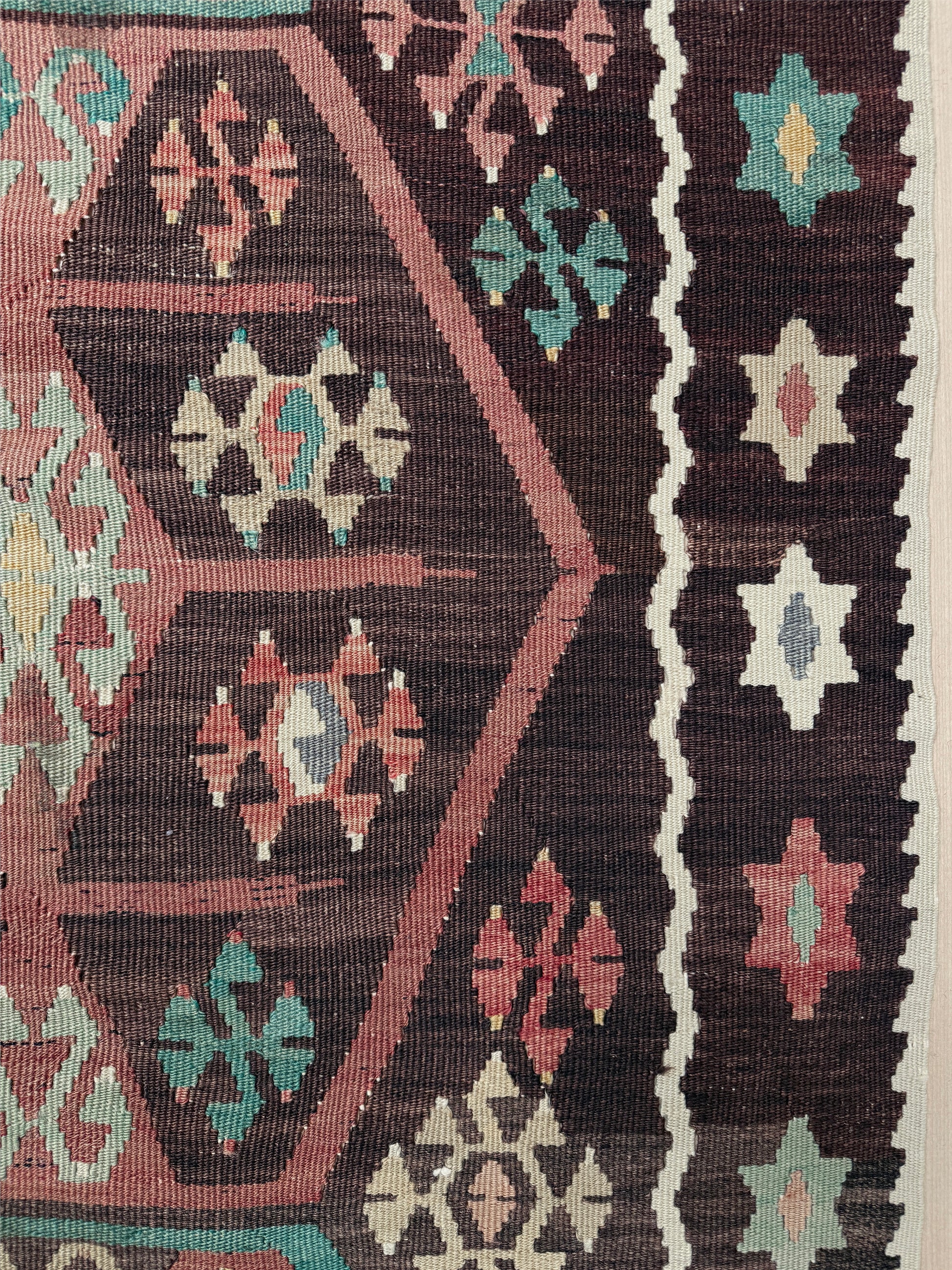 Vintage Kayseri Turkish kilim rug with earthy colors and geometric design, handmade wool flatweave 5x11 from Indigo Rugs Burlingame Bay Area.