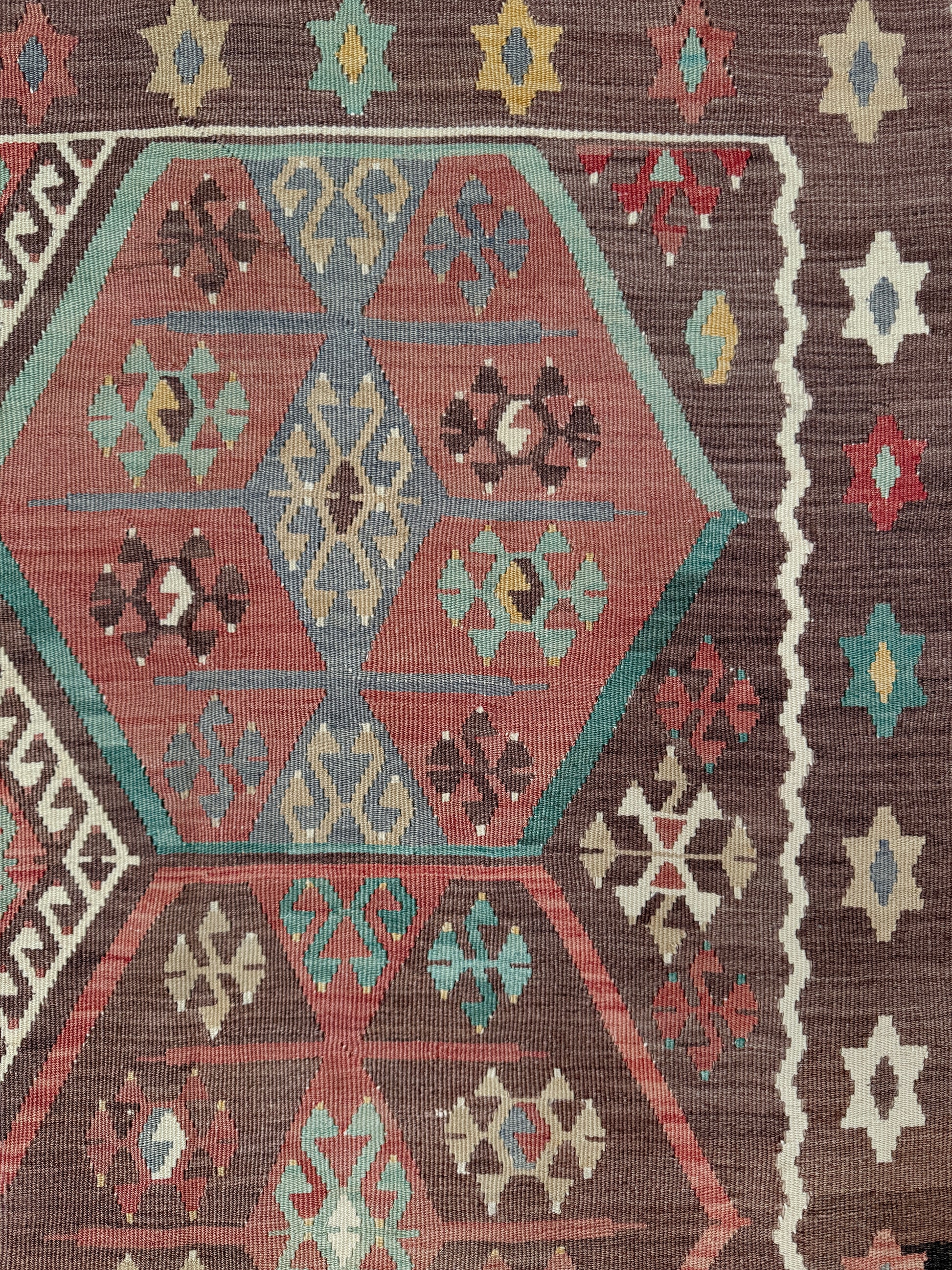 Vintage Kayseri Turkish kilim rug with earthy colors and geometric design, handmade wool flatweave 5x11 from Indigo Rugs Burlingame Bay Area.