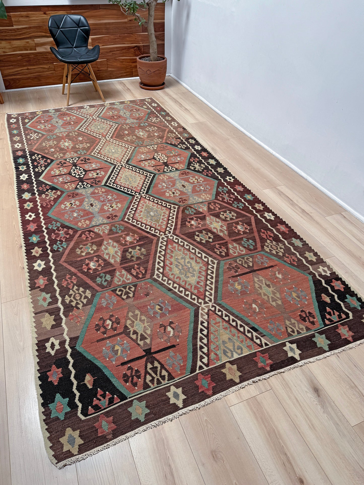 Vintage Kayseri Turkish kilim rug with earthy colors and blue-gray geometric medallions, handmade wool flatweave 5x11 from Indigo Rugs Burlingame Bay Area.