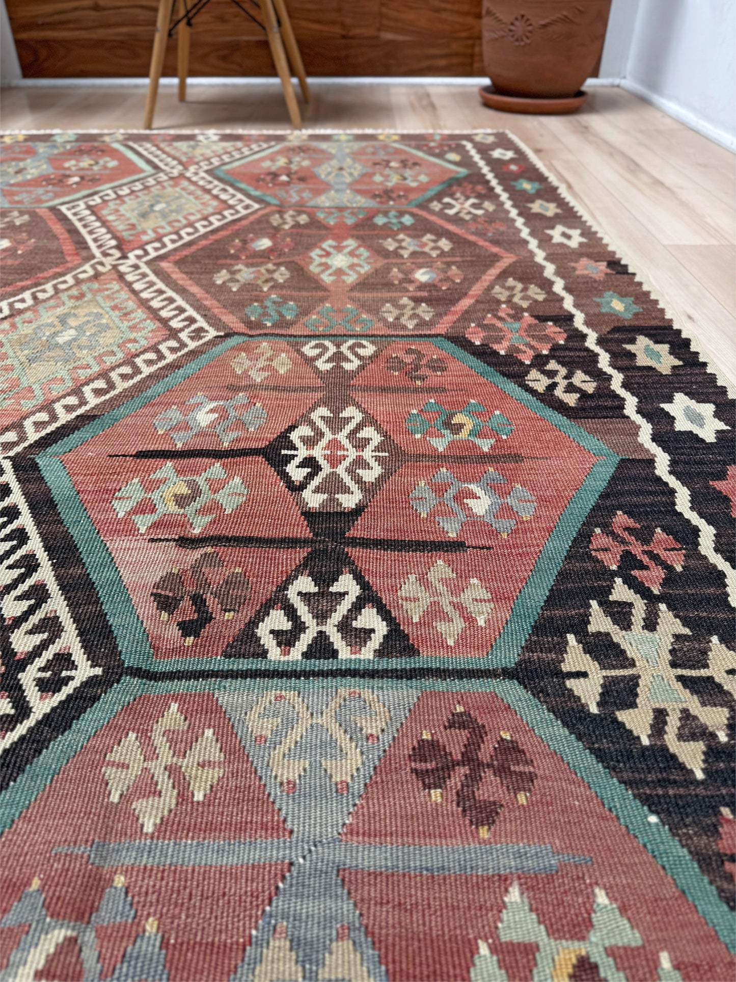 Vintage Kayseri Turkish kilim rug with earthy colors and blue-gray geometric medallions, handmade wool flatweave 5x11 from Indigo Rugs Burlingame Bay Area.