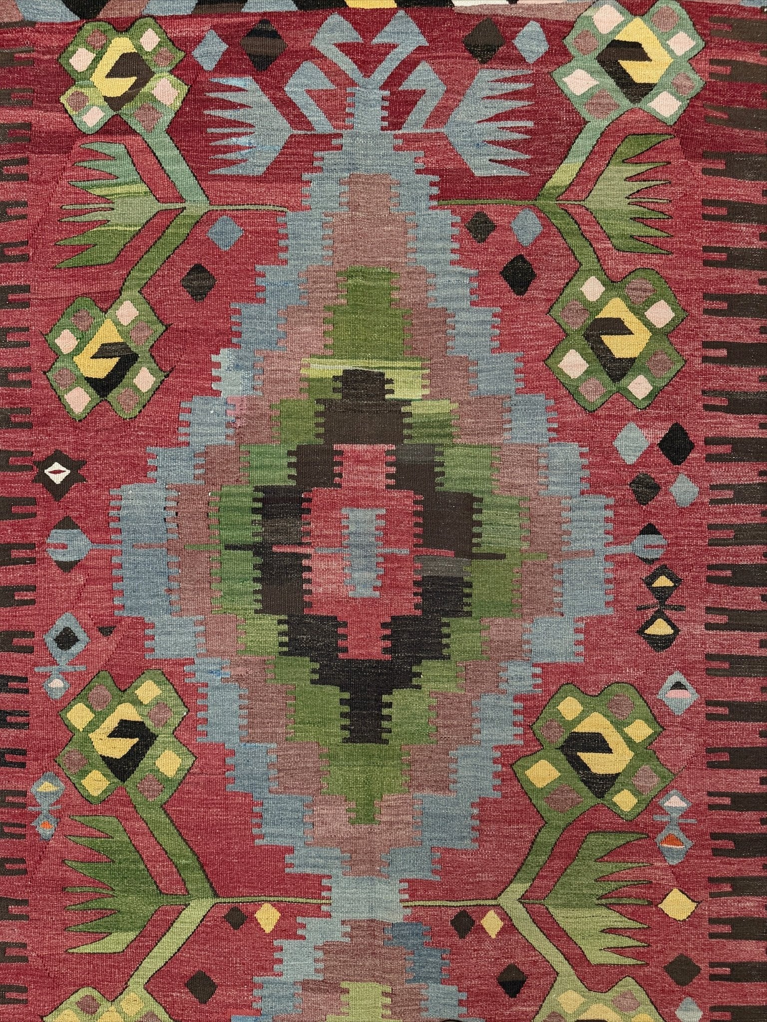 Vintage Esme Turkish kilim rug featuring in madder red, olive green colors, geometric medallions, handmade Anatolian wool flatweave rug measuring 6x10 in excellent vintage condition.