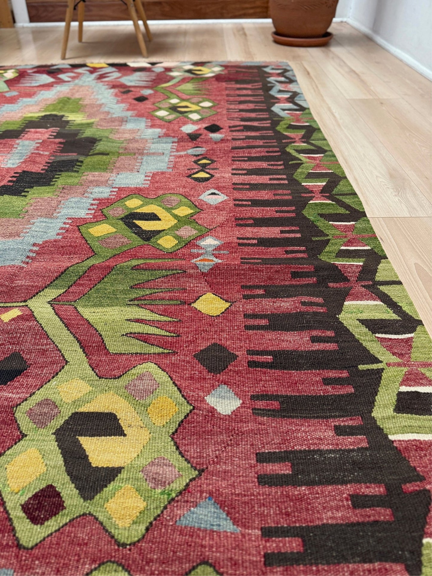 Vintage Esme Turkish kilim rug featuring in madder red, olive green colors, geometric medallions, handmade Anatolian wool flatweave rug measuring 6x10 in excellent vintage condition.