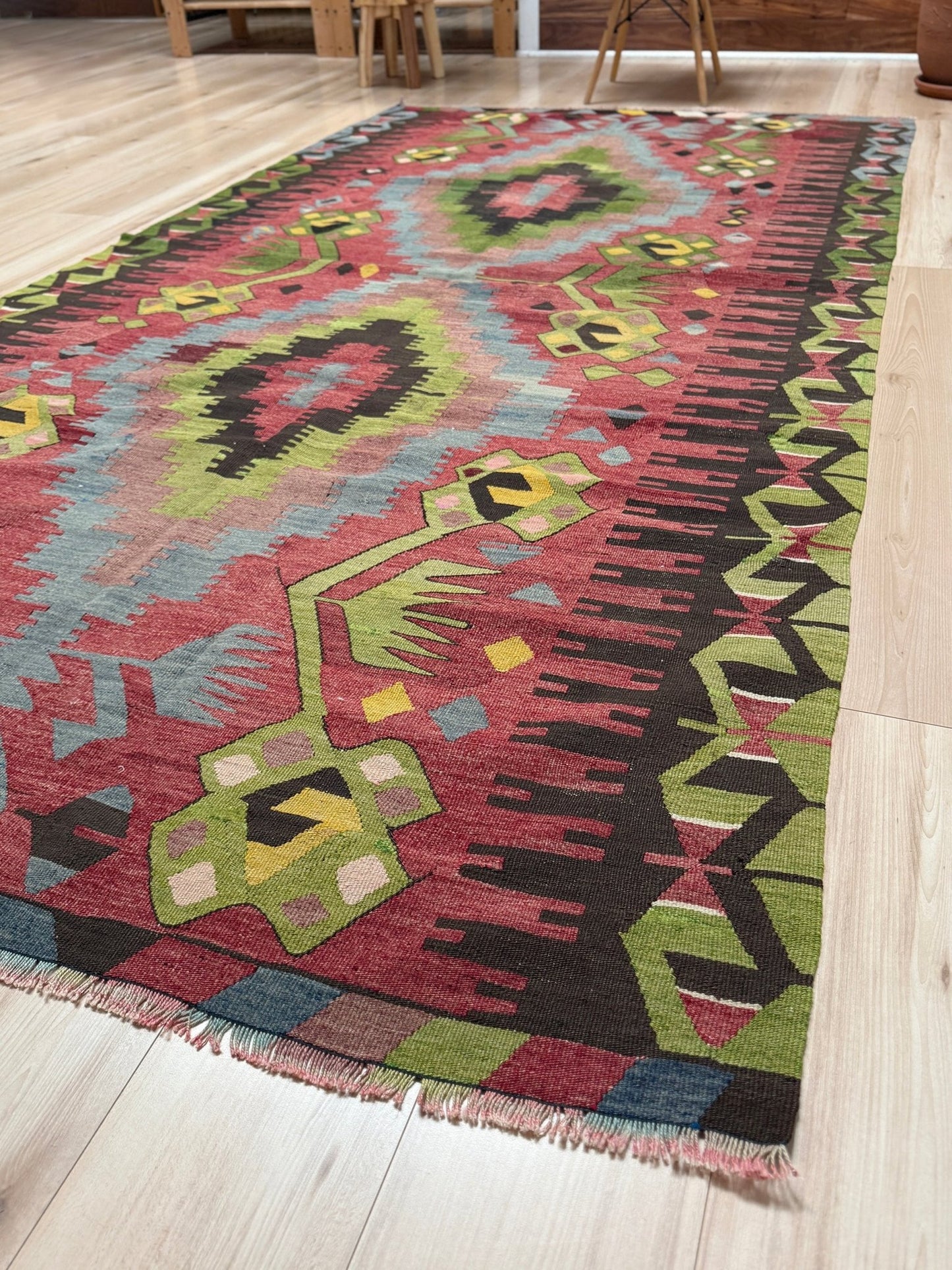 Vintage Esme Turkish kilim rug featuring in madder red, olive green colors, geometric medallions, handmade Anatolian wool flatweave rug measuring 6x10 in excellent vintage condition.