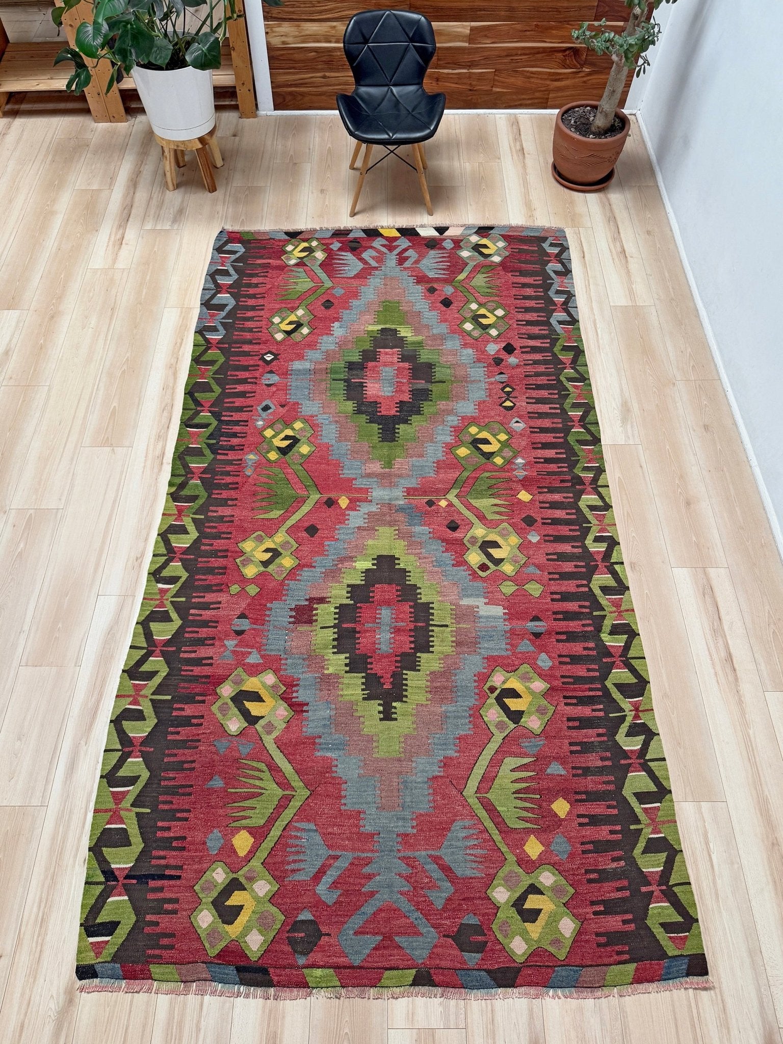 Vintage Esme Turkish kilim rug featuring in madder red, olive green colors, geometric medallions, handmade Anatolian wool flatweave rug measuring 6x10 in excellent vintage condition.