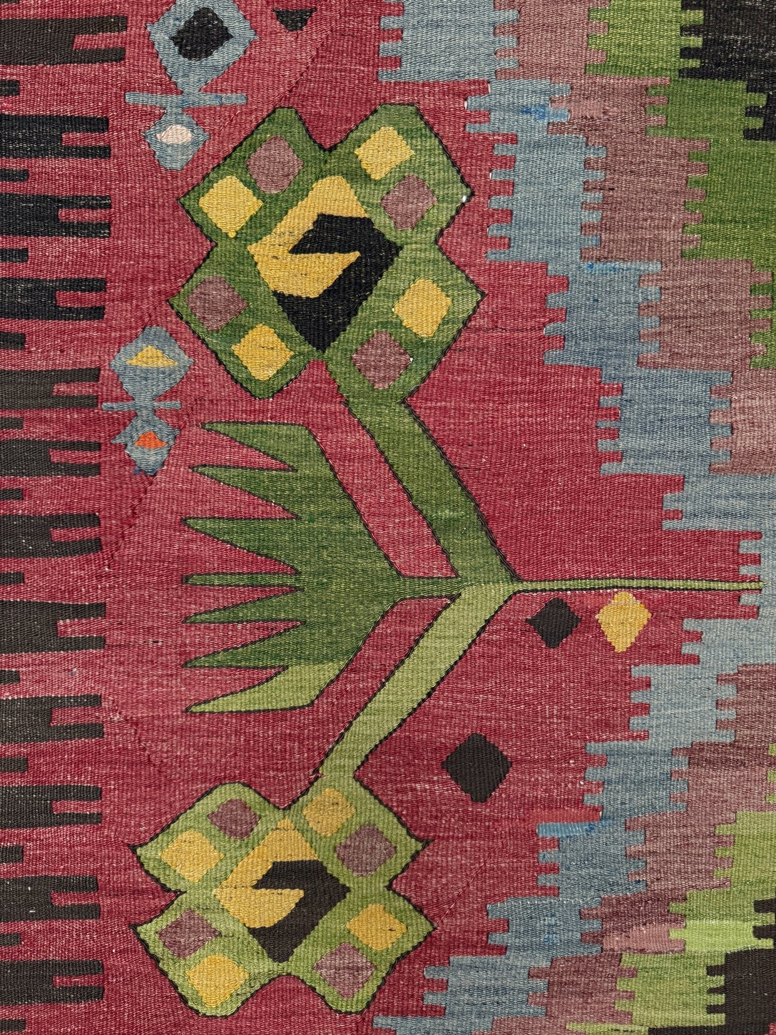 Vintage Esme Turkish kilim rug featuring in madder red, olive green colors, geometric medallions, handmade Anatolian wool flatweave rug measuring 6x10 in excellent vintage condition.