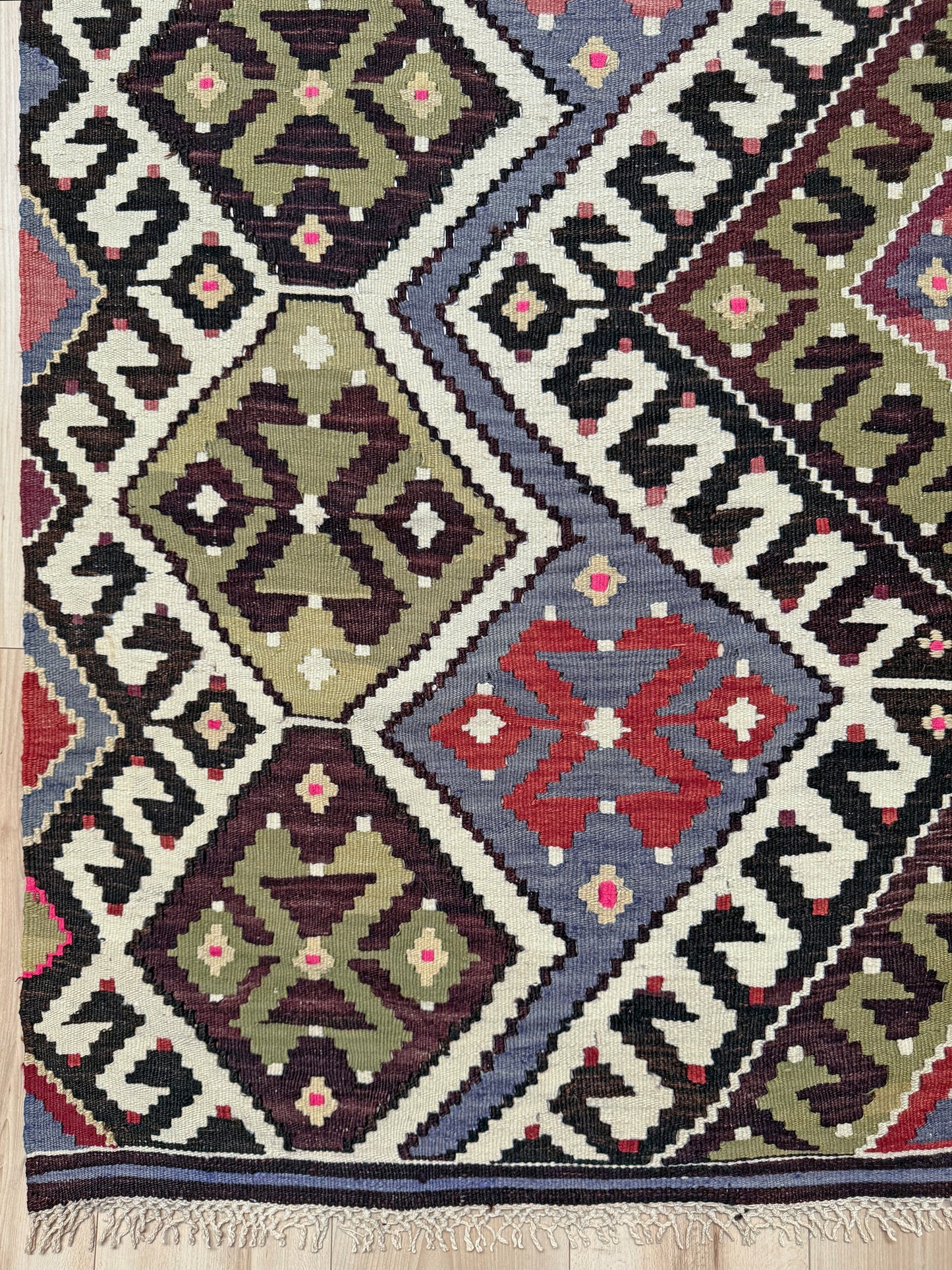 Vintage Esme Turkish kilim rug with repeating diamond medallions in muted olive green, deep plum, dusty periwinkle blue, handmade wool flatweave 6x12 from Indigo Rugs Burlingame Bay Area.
