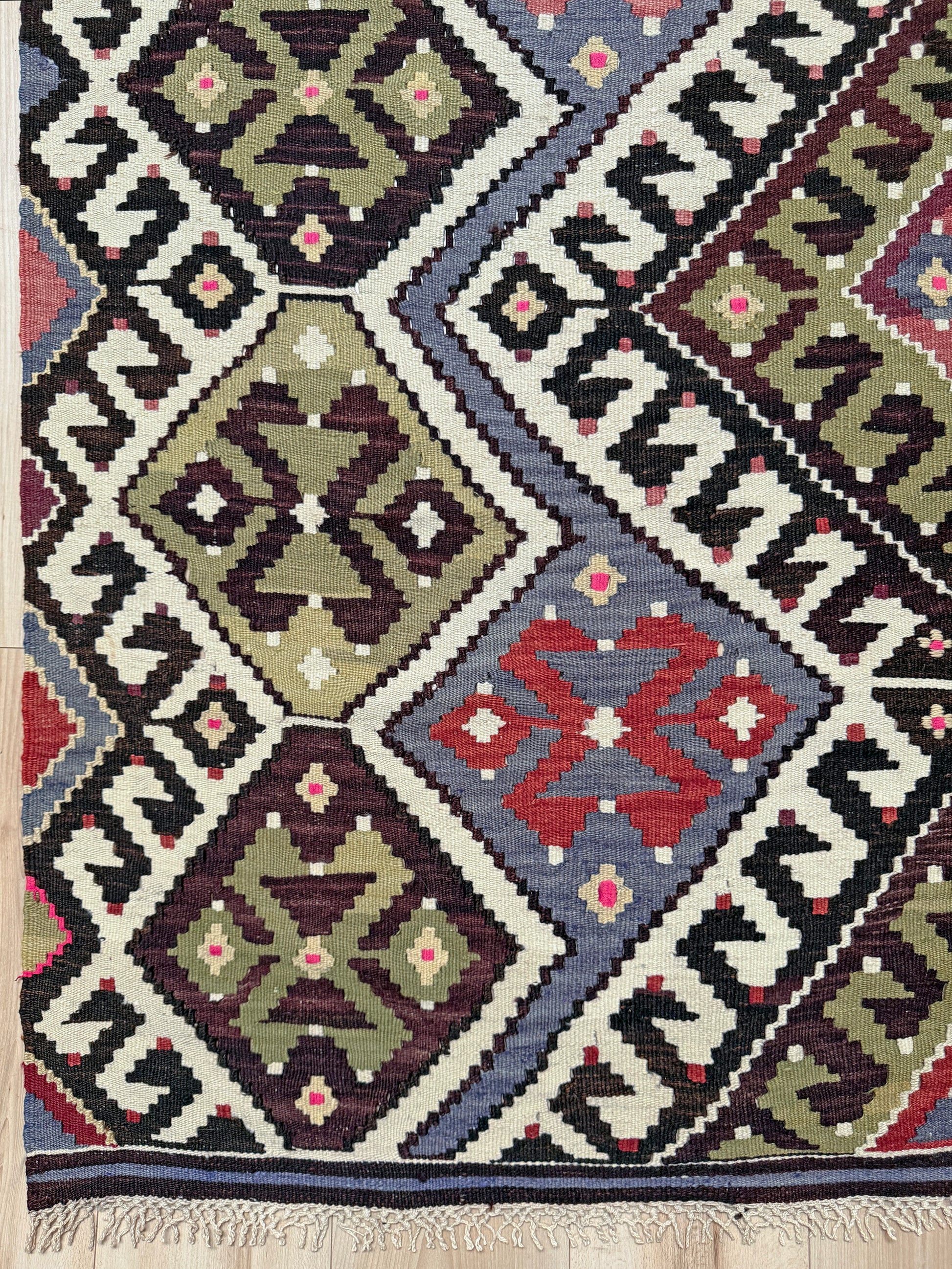 Vintage Esme Turkish kilim rug with repeating diamond medallions in muted olive green, deep plum, dusty periwinkle blue, handmade wool flatweave 6x12 from Indigo Rugs Burlingame Bay Area.