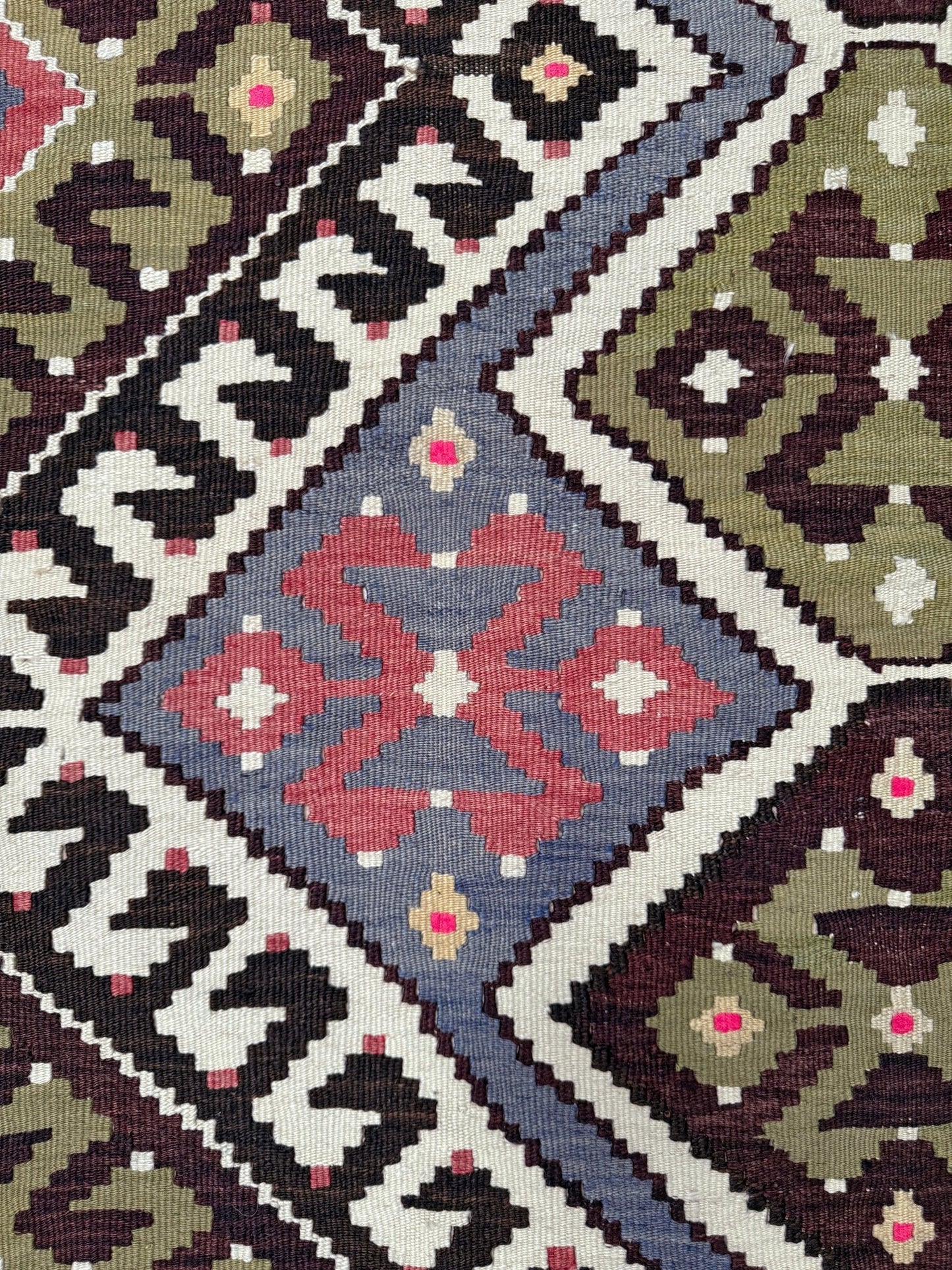 Vintage Esme Turkish kilim rug with repeating diamond medallions in muted olive green, deep plum, dusty periwinkle blue, handmade wool flatweave 6x12 from Indigo Rugs Burlingame Bay Area.