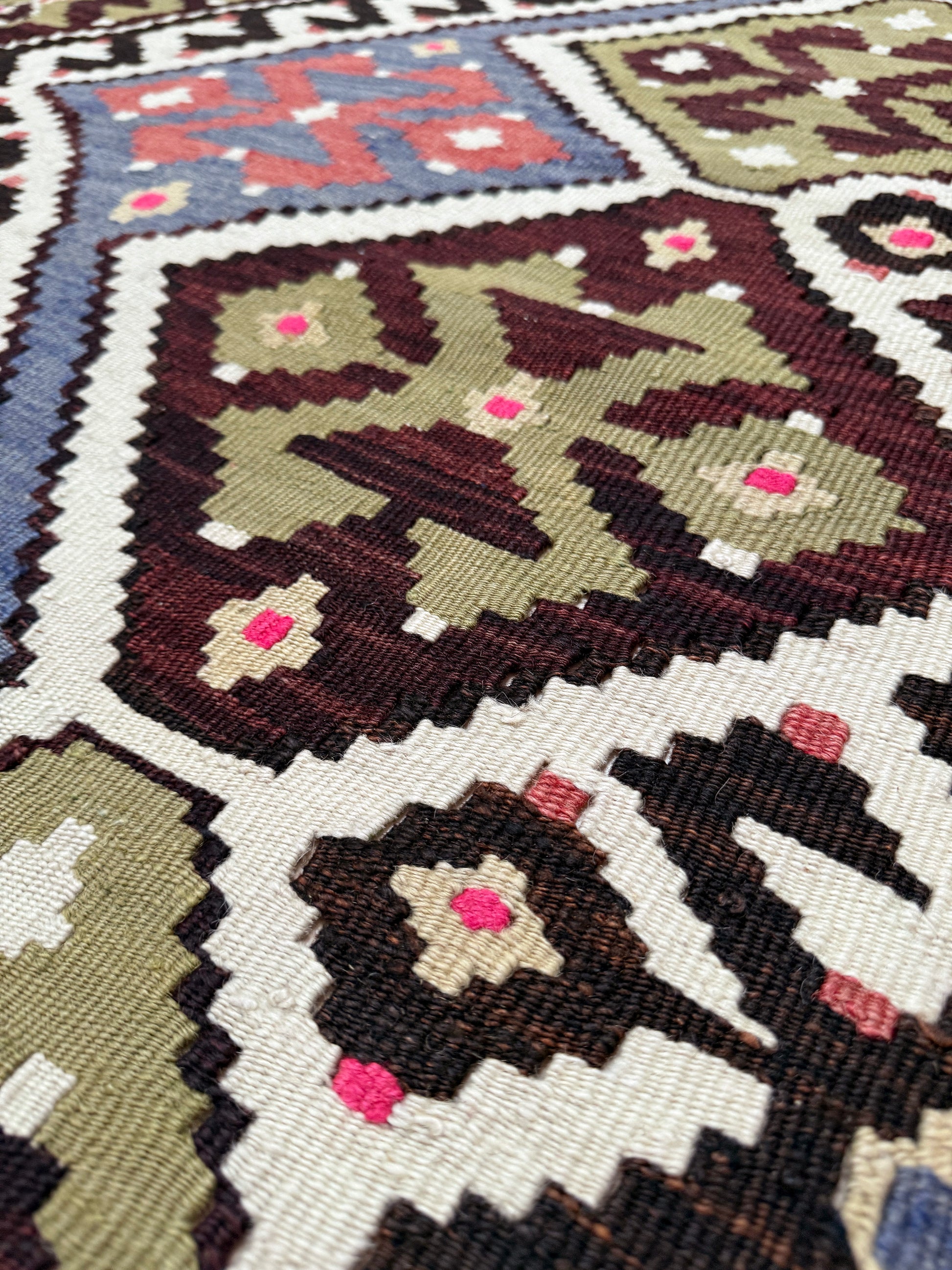Vintage Esme Turkish kilim rug with repeating diamond medallions in muted olive green, deep plum, dusty periwinkle blue, handmade wool flatweave 6x12 from Indigo Rugs Burlingame Bay Area.