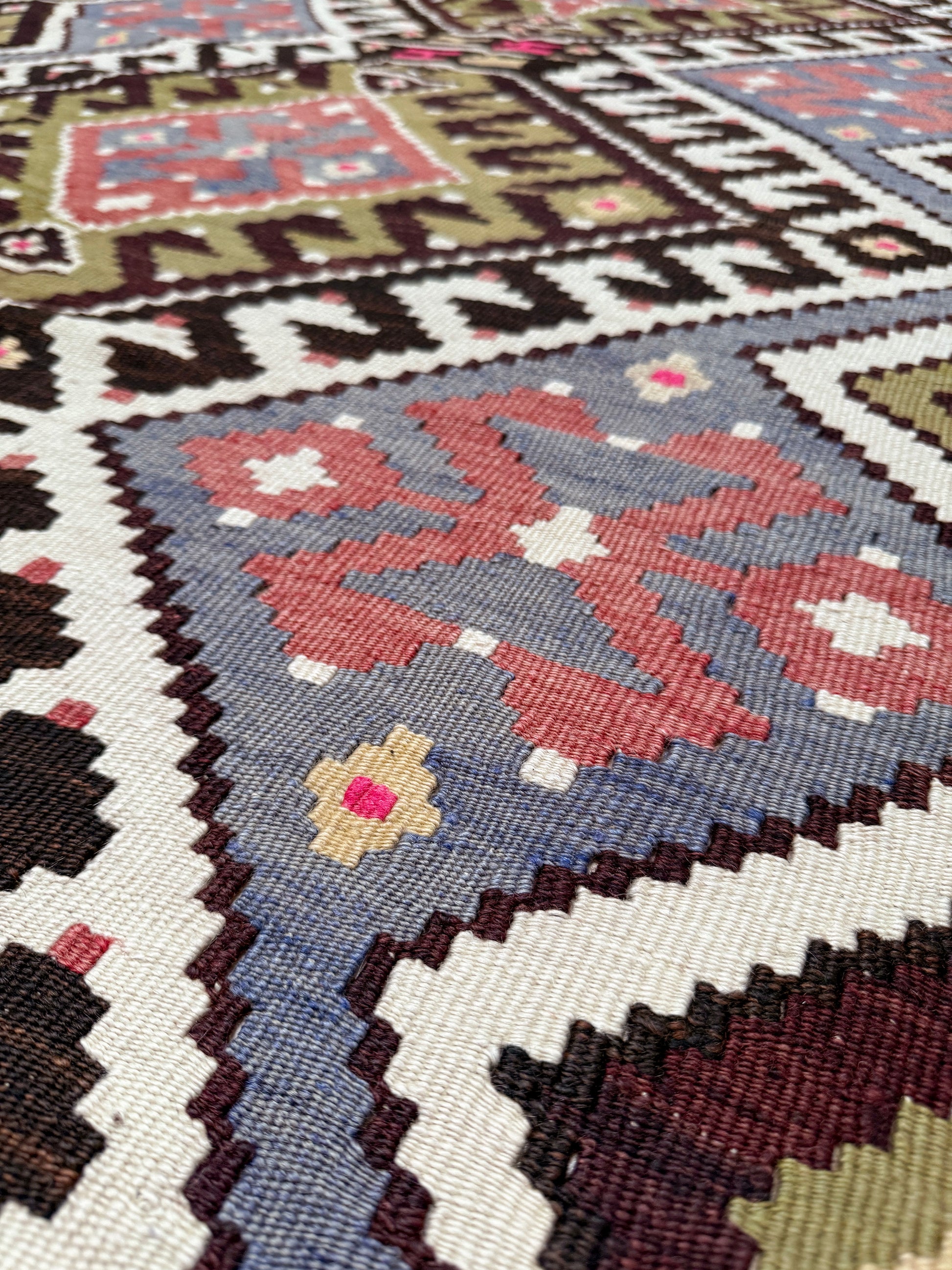 Vintage Esme Turkish kilim rug with repeating diamond medallions in muted olive green, deep plum, dusty periwinkle blue, handmade wool flatweave 6x12 from Indigo Rugs Burlingame Bay Area.