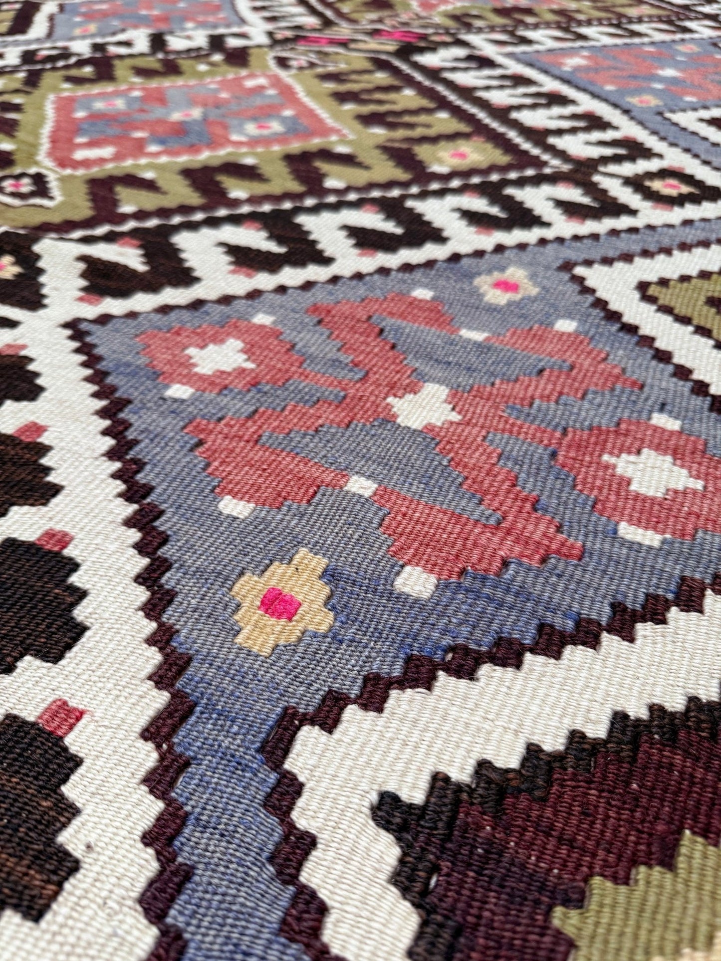 Vintage Esme Turkish kilim rug with repeating diamond medallions in muted olive green, deep plum, dusty periwinkle blue, handmade wool flatweave 6x12 from Indigo Rugs Burlingame Bay Area.