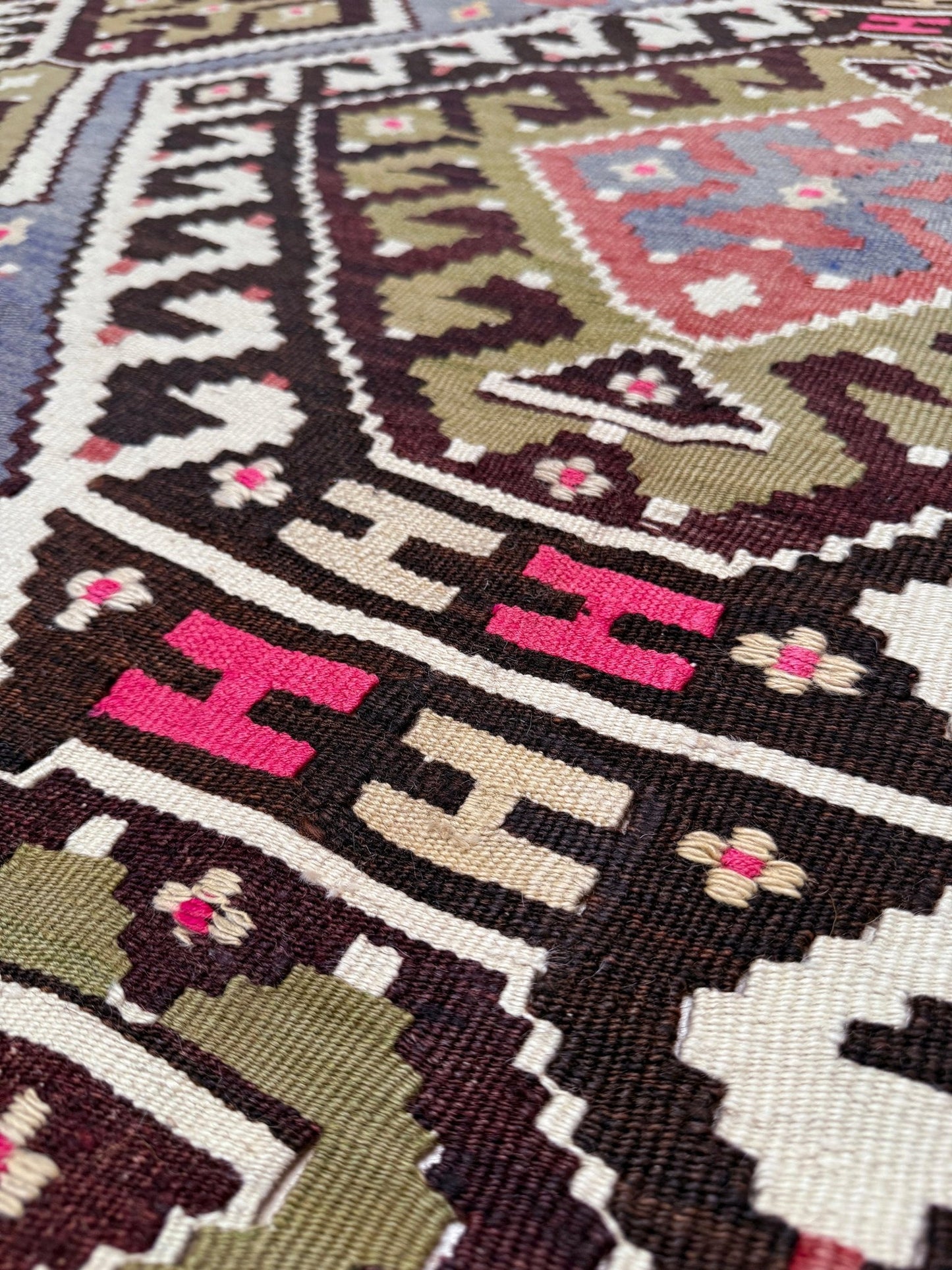 Vintage Esme Turkish kilim rug with repeating diamond medallions in muted olive green, deep plum, dusty periwinkle blue, handmade wool flatweave 6x12 from Indigo Rugs Burlingame Bay Area.