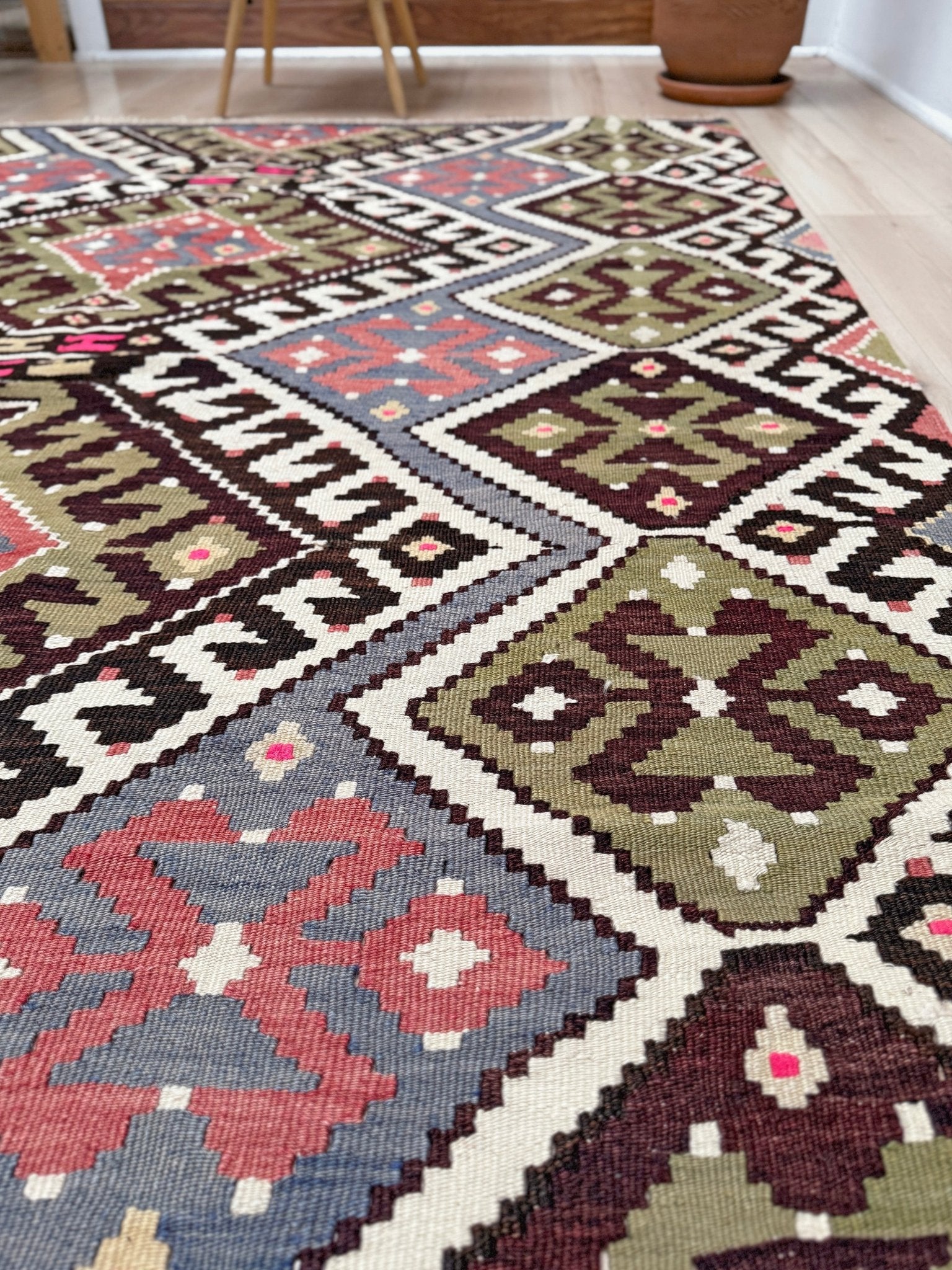 Vintage Esme Turkish kilim rug with repeating diamond medallions in muted olive green, deep plum, dusty periwinkle blue, handmade wool flatweave 6x12 from Indigo Rugs Burlingame Bay Area.